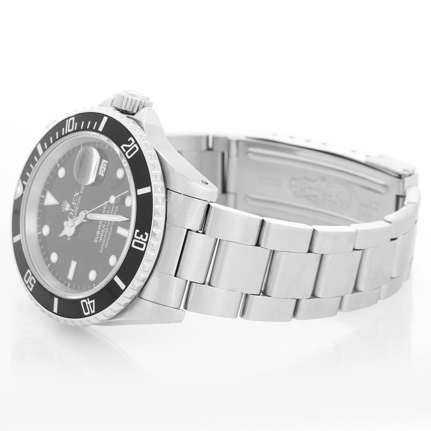 Rolex Submariner 16610 Stainless Steel Men's Watch - Automatic winding, 31 jewels, Quickset, sapphire crystal. Stainless steel case; rotating bezel with black insert. Black Dial. Stainless steel Oyster bracelet with flip-lock clasp. Pre-owned with