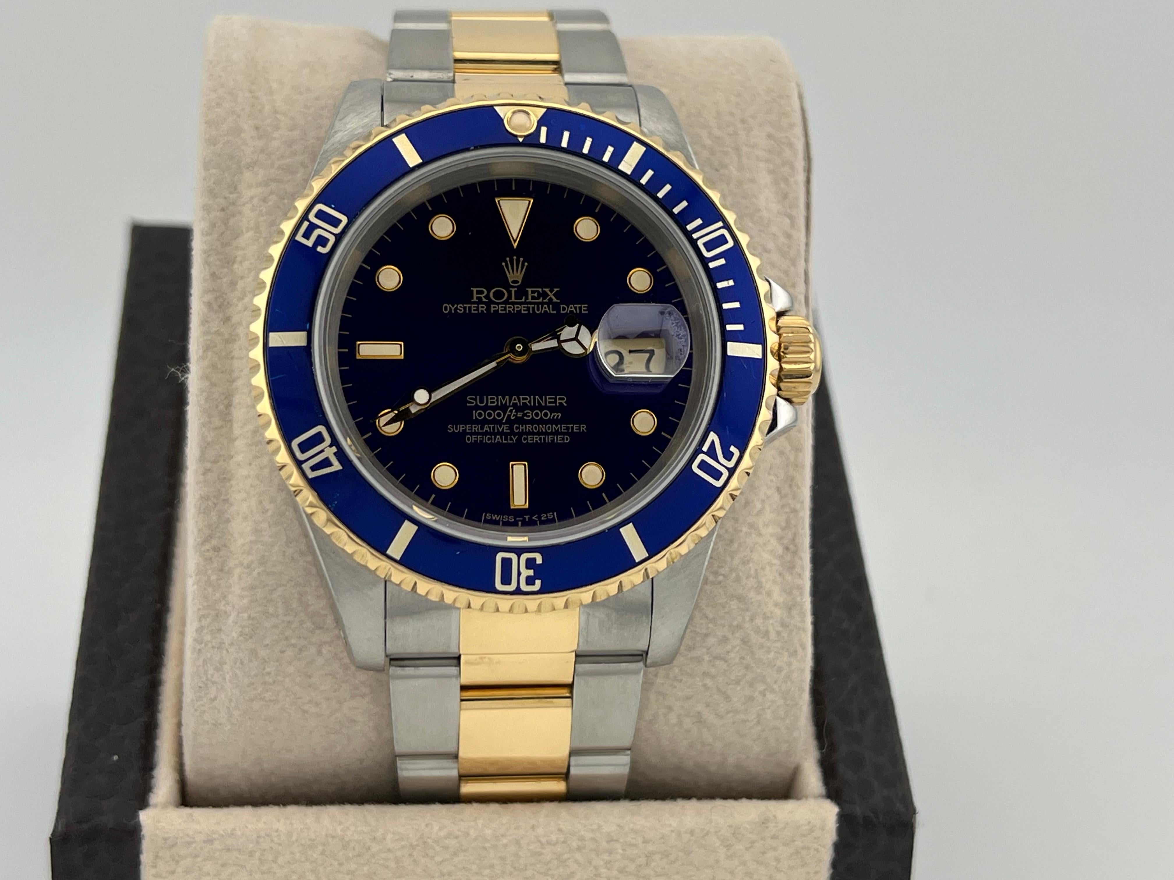 Stilnummer: 16613



Seriennummer: E71***



Jahr: 1990

 

Modell: Rolex Submariner

 

MATERIAL des Gehäuses: Rostfreier Stahl 

 

Band: 18K Gelbgold & Edelstahl 

 

Lünette: Blau

 

Zifferblatt: Blau 

 

Gesicht: Saphirglas 

 

Gehäusegröße: