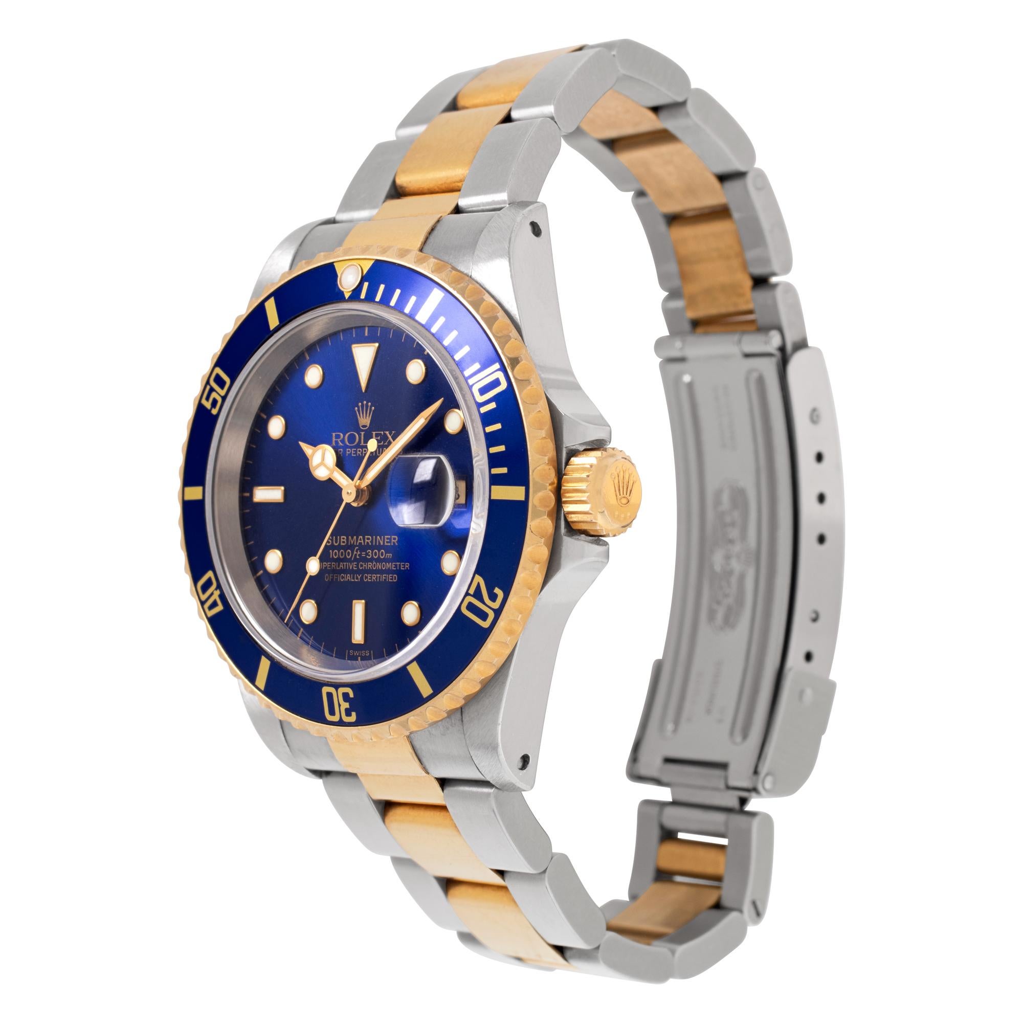 Rolex Submariner in 18k yellow gold and stainless steel with blue dial. Auto w/ sweep seconds and date. 40 mm case size. **Bank wire only at this price** Ref 16613. Circa 1997. Fine Pre-owned Rolex Watch. Certified preowned Sport Rolex Submariner