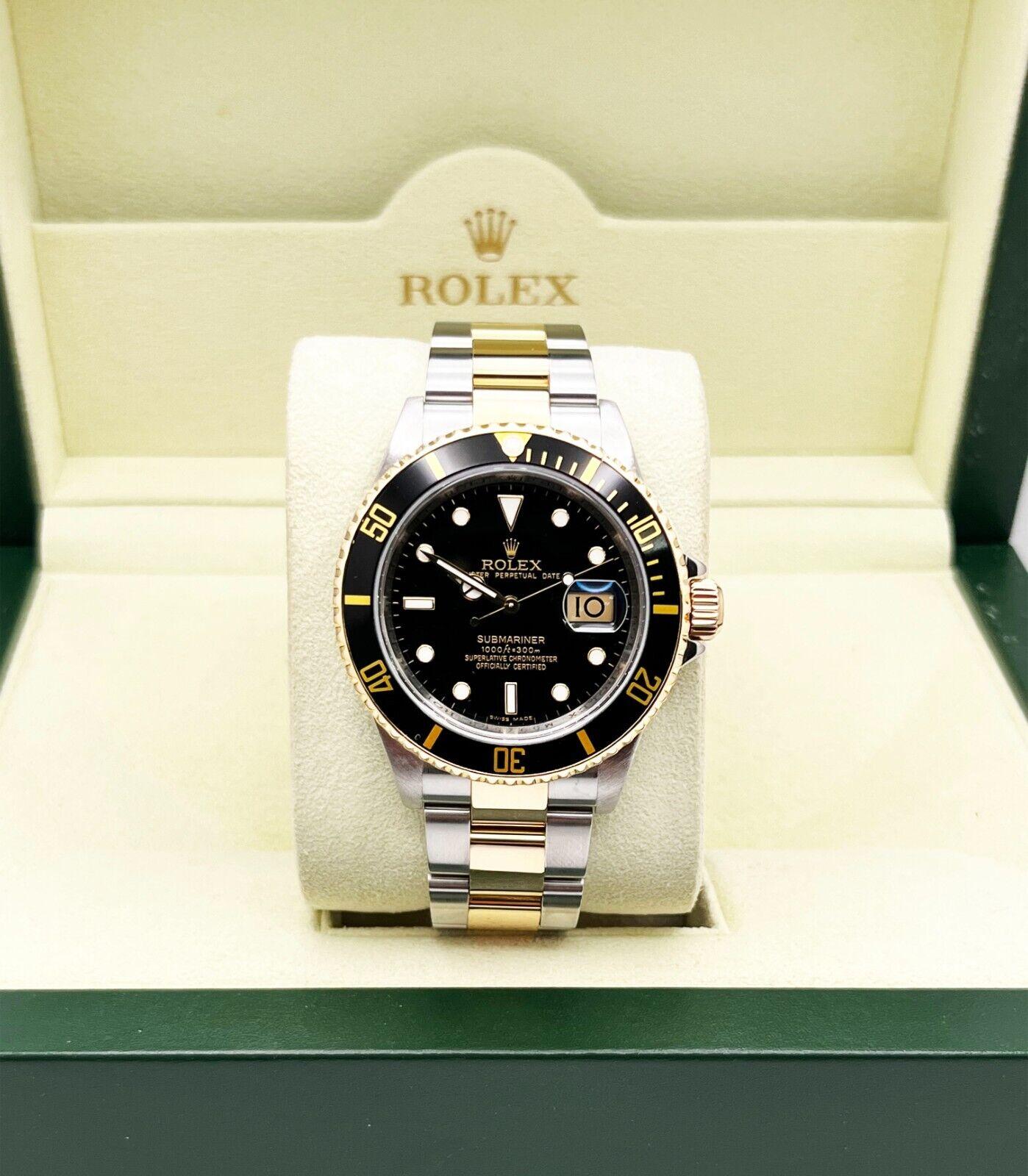 Rolex Submariner 16613 Schwarzes Zifferblatt 18K Gelbgold Stahl 2011 Rehaut Box Papier Herren
