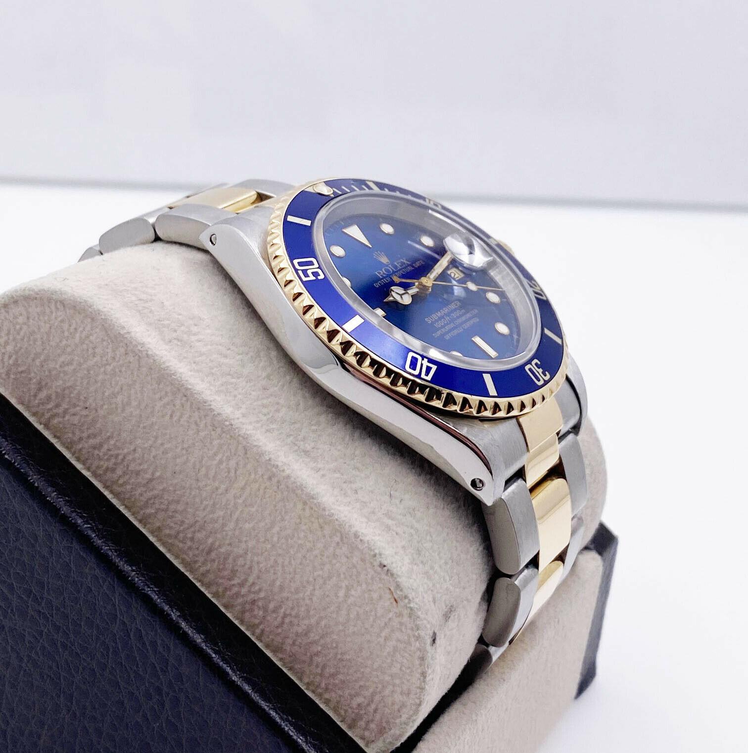 Style Number: 16613

Serial: U107***

Model: Submariner

Case Material: Stainless Steel

Band: 18K Yellow Gold & Stainless Steel

Bezel: Blue

Dial: Blue

Face: Sapphire Crystal

Case Size: 40mm

Includes: 
-Elegant Watch Box
-Certified Appraisal