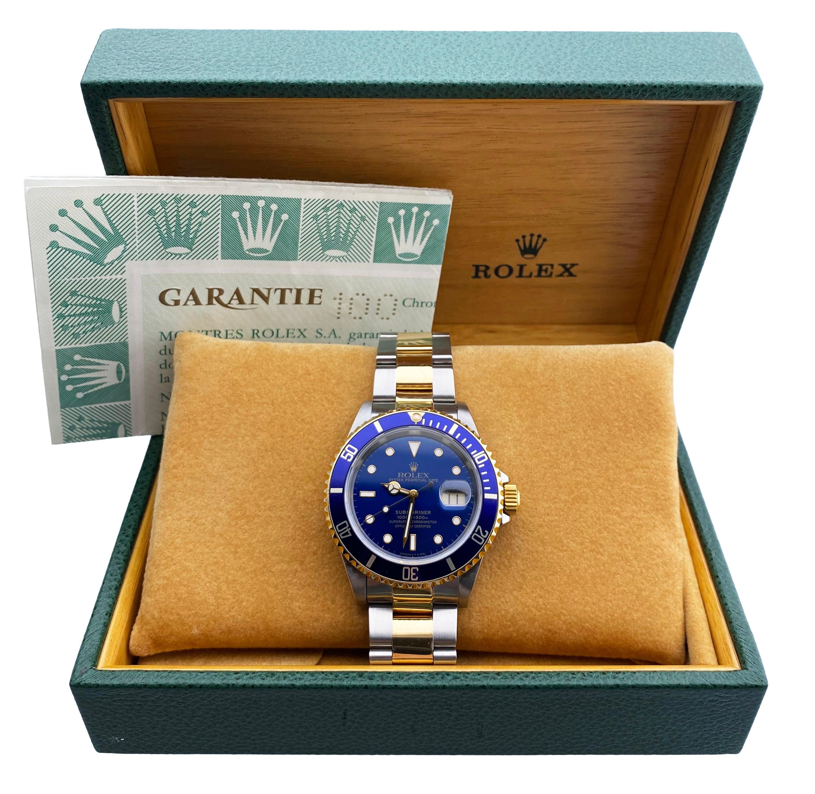 Rolex Submariner 16613 Men Watch. 40mm Stainless Steel case. 18k yellow gold bezel with blue insert. Blue dial with Luminous Steel hands and luminous dot hour markers. Date display at the 3 o'clock position. Oyster two tone, 18K yellow gold &