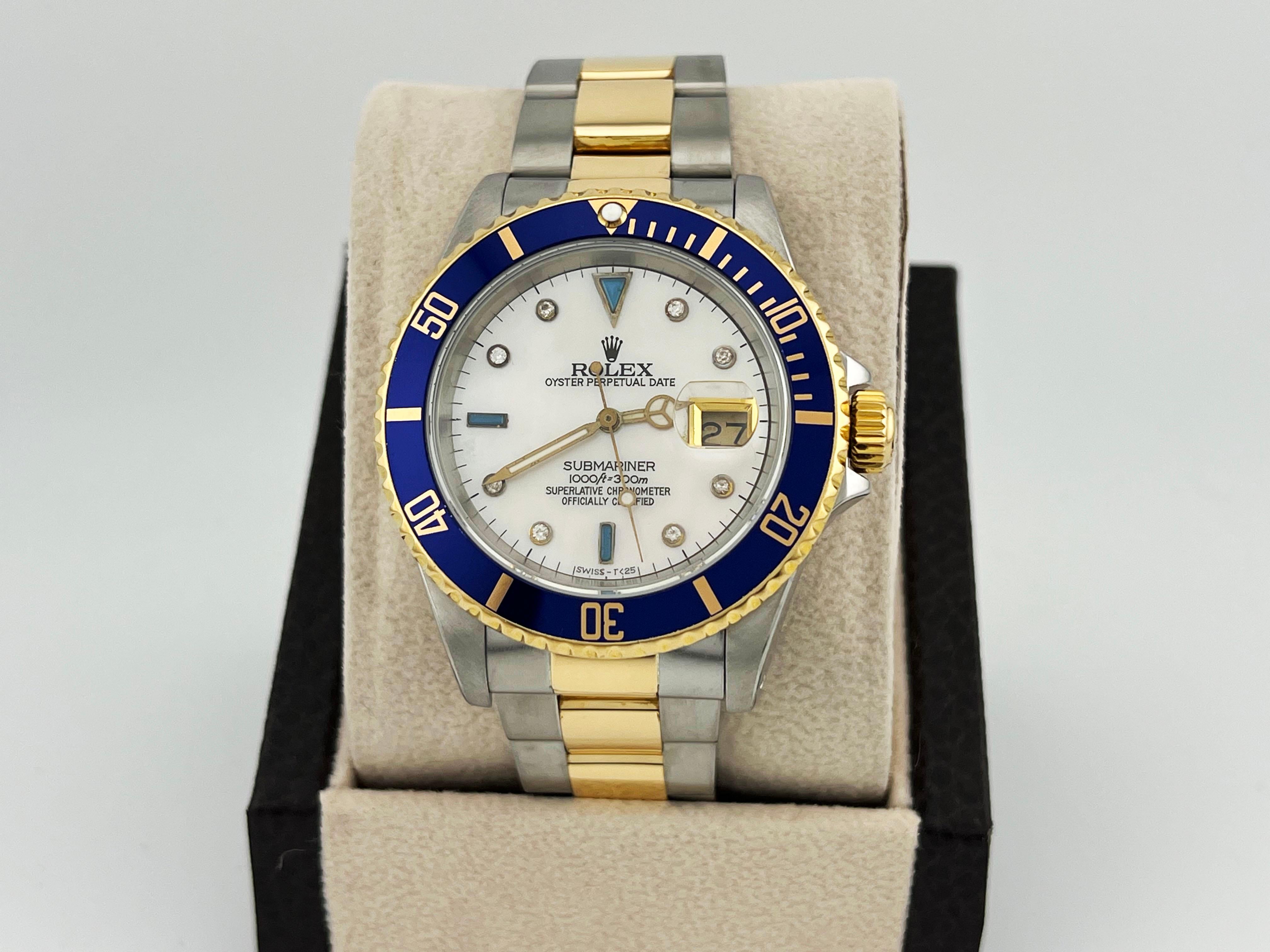 Style Number: 16613

Serial: L942***

Year: 1989

Model: Rolex Submariner 

Case Material: Stainless Steel 

Band: 18K Yellow Gold & Stainless Steel 

Bezel: Blue

Dial: Custom Mother Of Pear Serti Dial

Face: Sapphire Crystal 

Case Size: 40mm