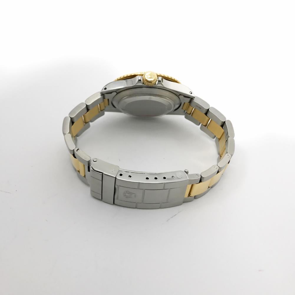 Rolex Submariner Reference #:16613. 16613 Mens Rolex Submariner Slate Serti Dial with an 18kt Yellow Gold Sport bezel and an oyster bracelet with diver's extension. Verified and Certified by WatchFacts. 1 year warranty offered by WatchFacts.
