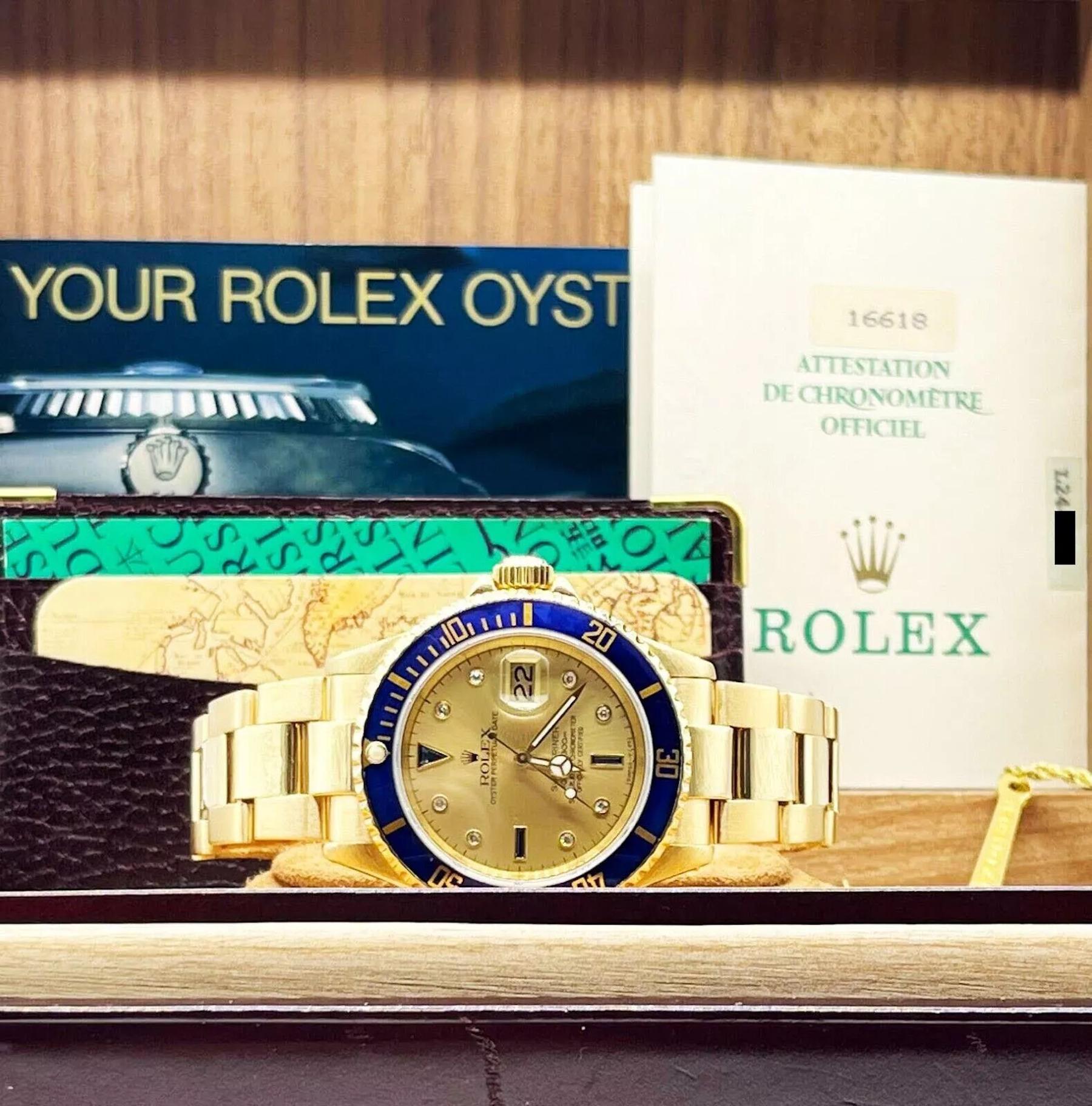 Style Number: 16618
Serial: L244***
Year: 1989
Model: Rolex Submariner 
Case Material: 18K Yellow Gold 
Band: 18K Yellow Gold 
Bezel: Blue
Dial: Factory Original Champagne Serti Diamond and Sapphire Dial 
Face: Sapphire Crystal 
Case Size: