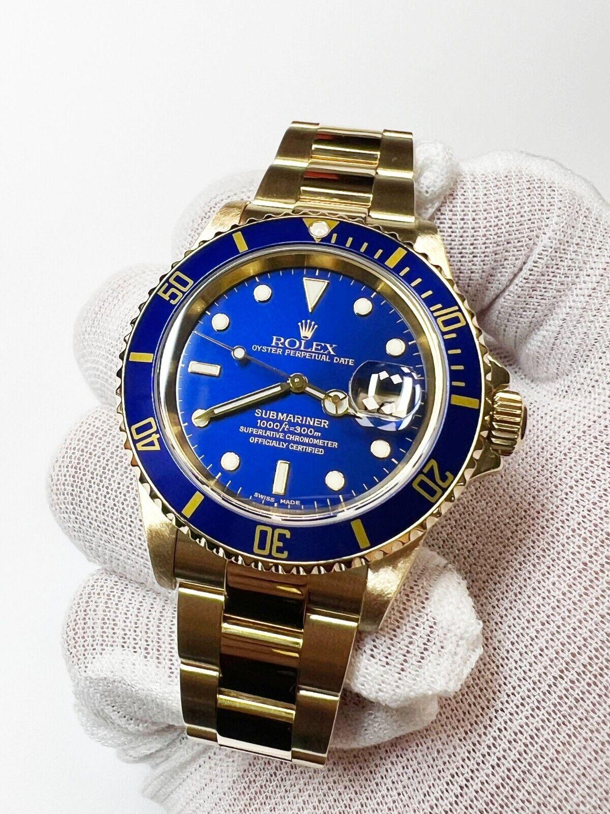 Style Number: 16618

Serial: Y348***

ProductionYear: 2002
 
Model: Submariner
 
Case Material: 18K Yellow Gold
 
Band: 18K Yellow Gold
 
Bezel: Blue
 
Dial: Blue
 
Face: Sapphire Crystal 
 
Case Size: 40mm 
 
Includes: 
-Rolex Box &