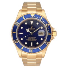 Rolex Submariner 16618 blaues Zifferblatt 18K Gelbgold Herrenuhr Box Papiere