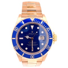 Montre pour homme Rolex Submariner 16618 Oyster en or jaune 18 carats avec cadran bleu soleillé