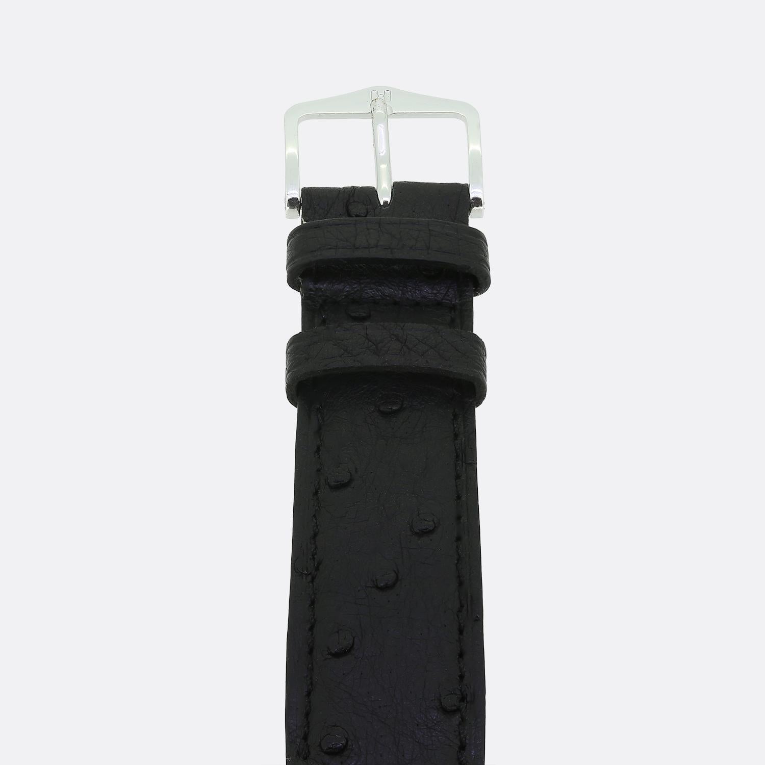 This Rolex Submariner showcases a robust stainless steel construction. The black dial is accentuated by luminous hour markers and hands, ensuring visibility in low light conditions. The watch is equipped with a durable black strap, complementing the