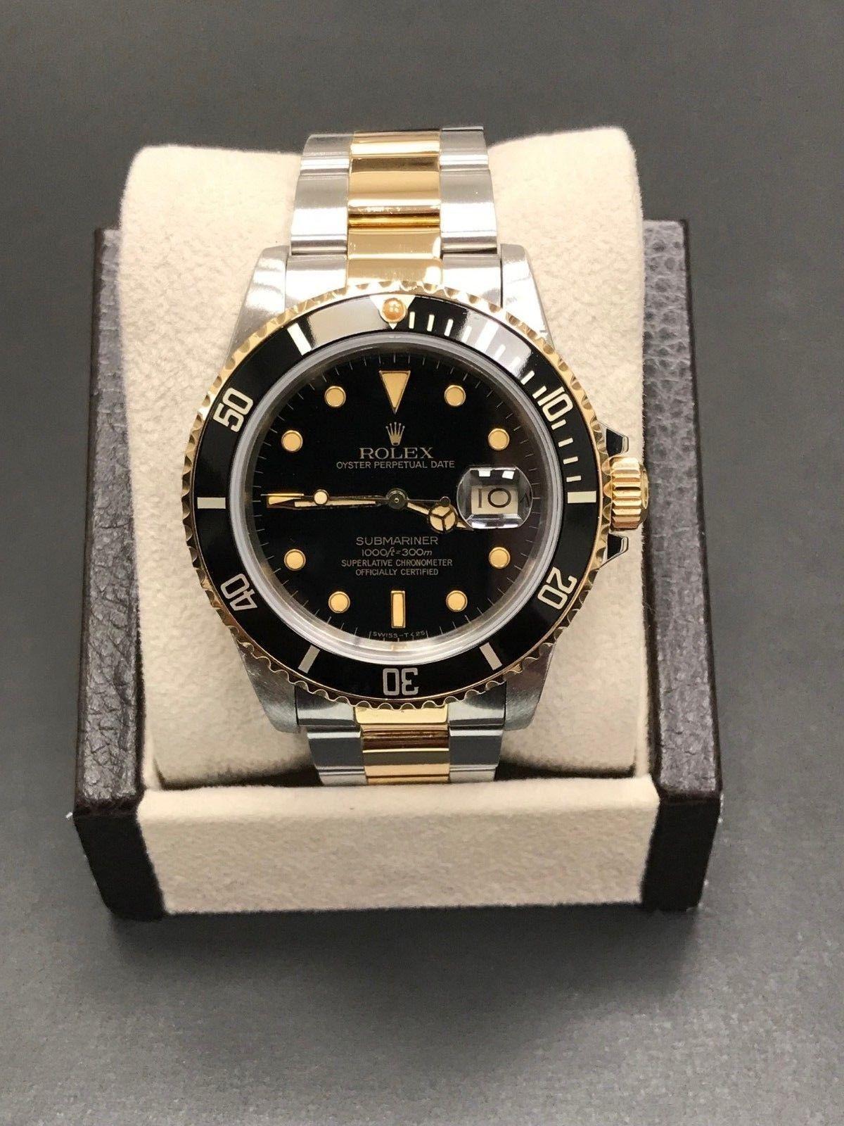 Style Number: 16803
 
Serial: 8510***
 
Year: 1985
 
Model: Submariner 
 
Case Material: Stainless Steel 
 
Band: 18K Yellow Gold & Stainless Steel 
 
Bezel: Black
 
Dial: Black
 
Face: Sapphire Crystal 
 
Case Size: 40mm
 
Includes: 
-Elegant Watch