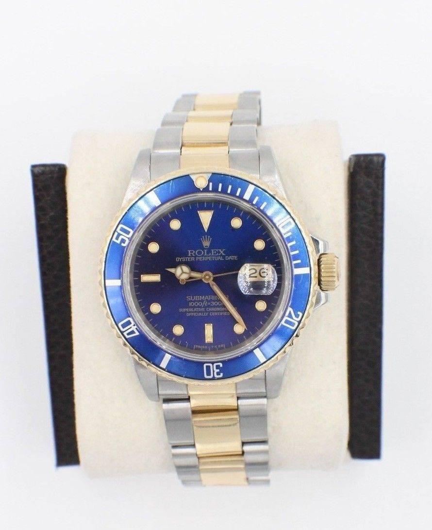Style Number: 16803
Serial: R621***
Model: Submariner
Case: Stainless Steel 
Band: 18K Yellow Gold & Stainless Steel
Bezel: Blue
Dial: Blue
Face: Sapphire Crystal 
Case Size: 40mm 
Movement: Automatic
Features: Date Window - Screw Down Crown -
