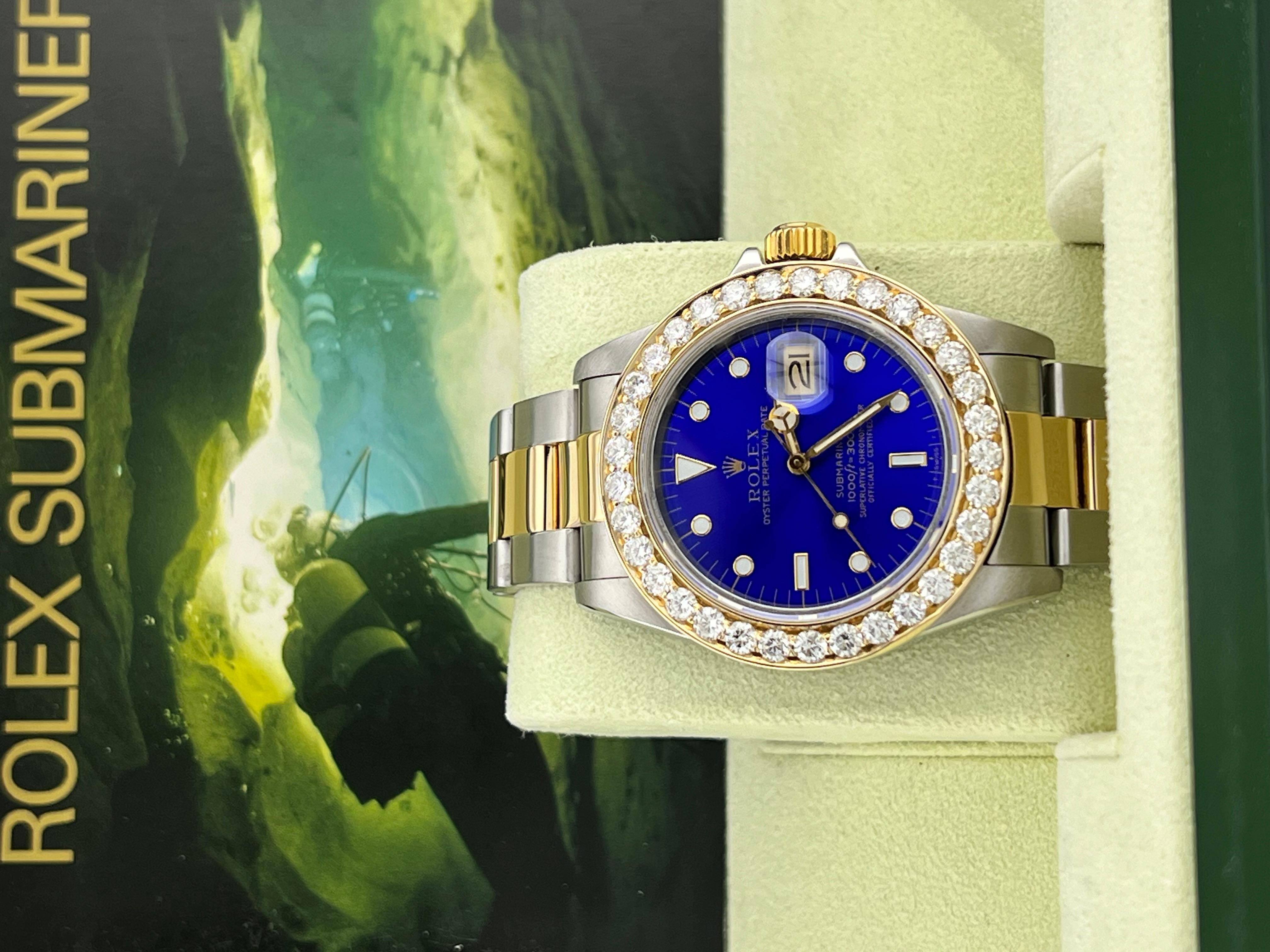 Style Number: 16803
Serial: 8365***
Year: 1984
Model: Rolex Submariner 
Case Material: Stainless Steel 
Band: 18K Yellow Gold & Stainless Steel 
Bezel: Custom Diamond Bezel 
Dial: Blue Dial 
Face: Sapphire Crystal 
Case Size: 40mm 
Includes: