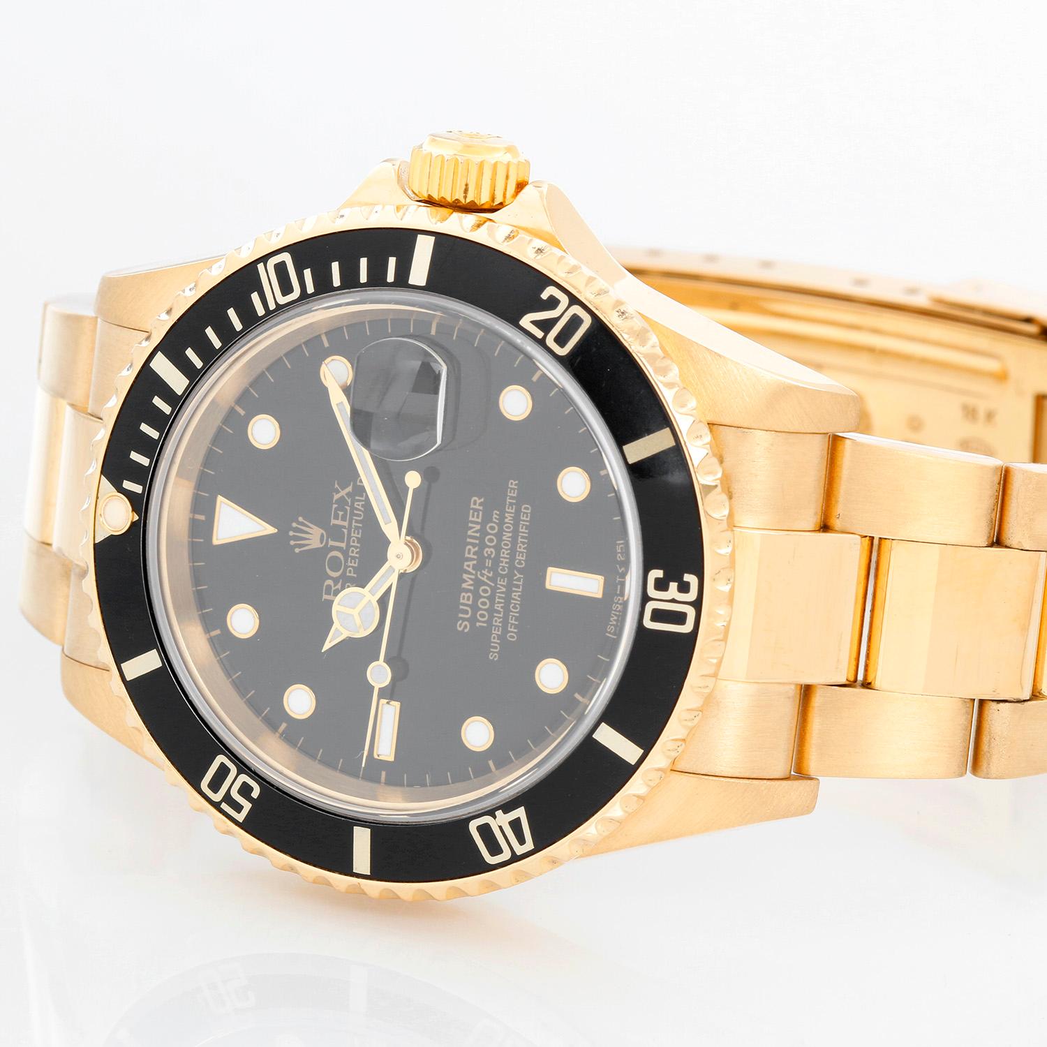 Rolex Submariner 18k Gold Men's Watch 16618 Black Dial - Automatic winding, 31 jewels, Quickset, sapphire crystal. 18k yellow gold case with rotating bezel with black insert (40mm diameter). Black  dial with white hour markers. 18k yellow gold