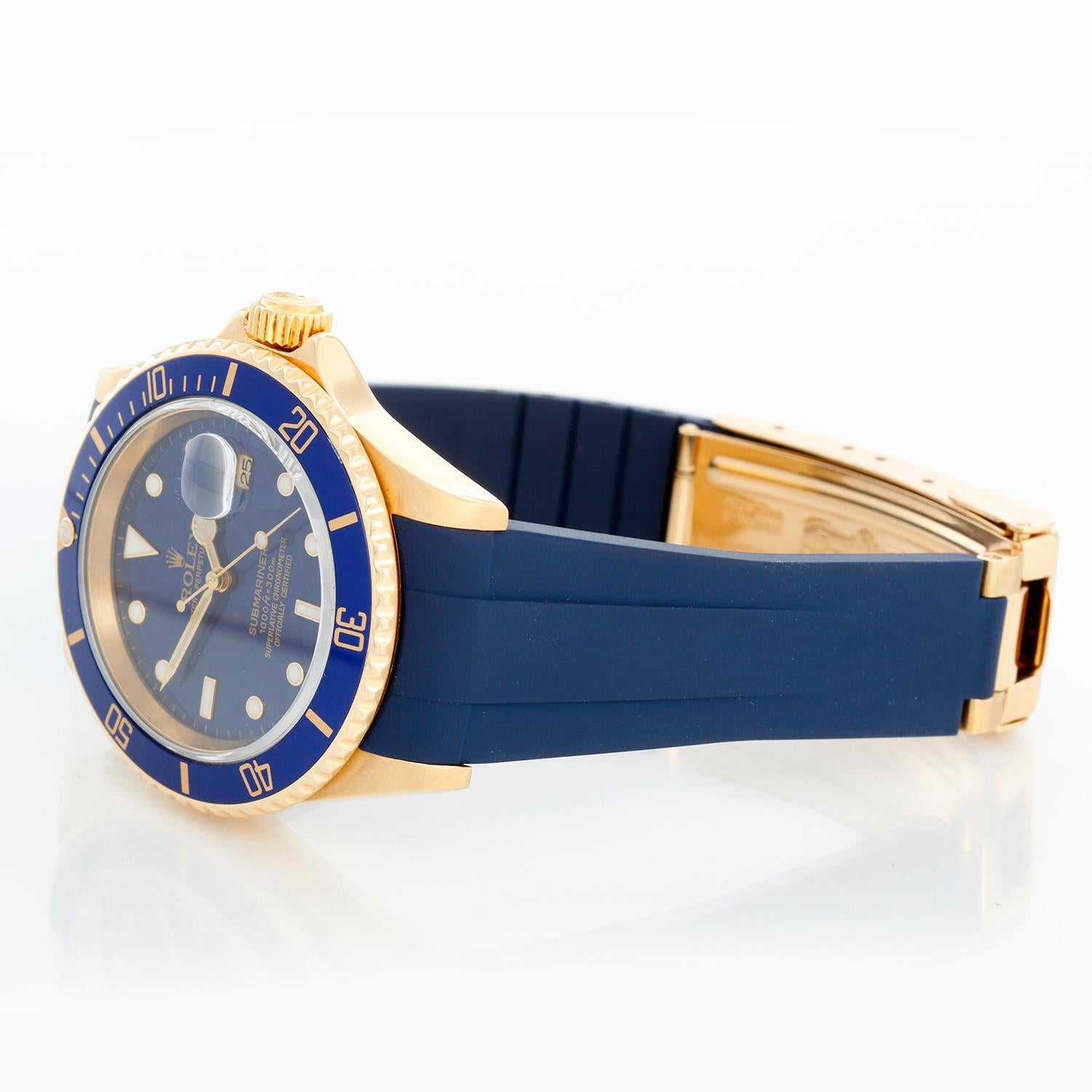 Rolex Submariner 18k Gold Men's Watch 16618 Blue Dial - Automatic winding, 31 jewels, Quickset, sapphire crystal. 18k yellow gold case with rotating bezel with blue insert (40mm diameter). Blue dial. Blue Rubber B strap with 18K Yellow gold buckle .
