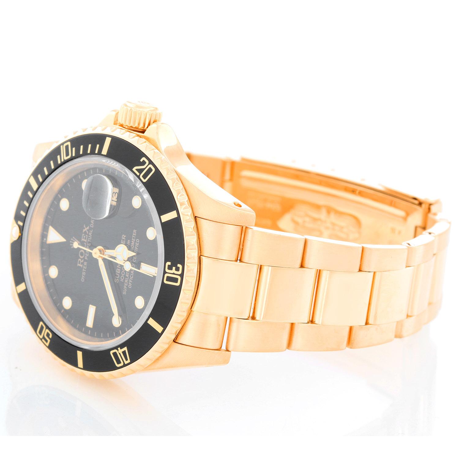 Rolex Submariner 18k Gold Men's Watch 16618  - Automatic winding, 31 jewels, Quickset, sapphire crystal. 18k yellow gold case with rotating bezel with black insert (40mm diameter). Black dial with white hour markers. 18k yellow gold Oyster bracelet