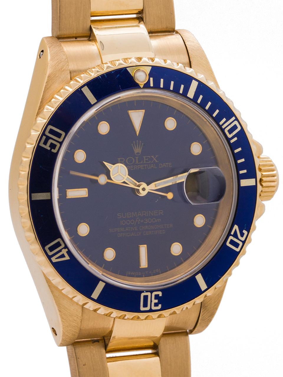 
A very fine condition example of the classic, now discontinued, Rolex 18K gold Submariner ref # 16618 serial# E6 circa 1990. Featuring a 40mm diameter case with unidirectional black elapsed time bezel, sapphire crystal, beautiful condition original