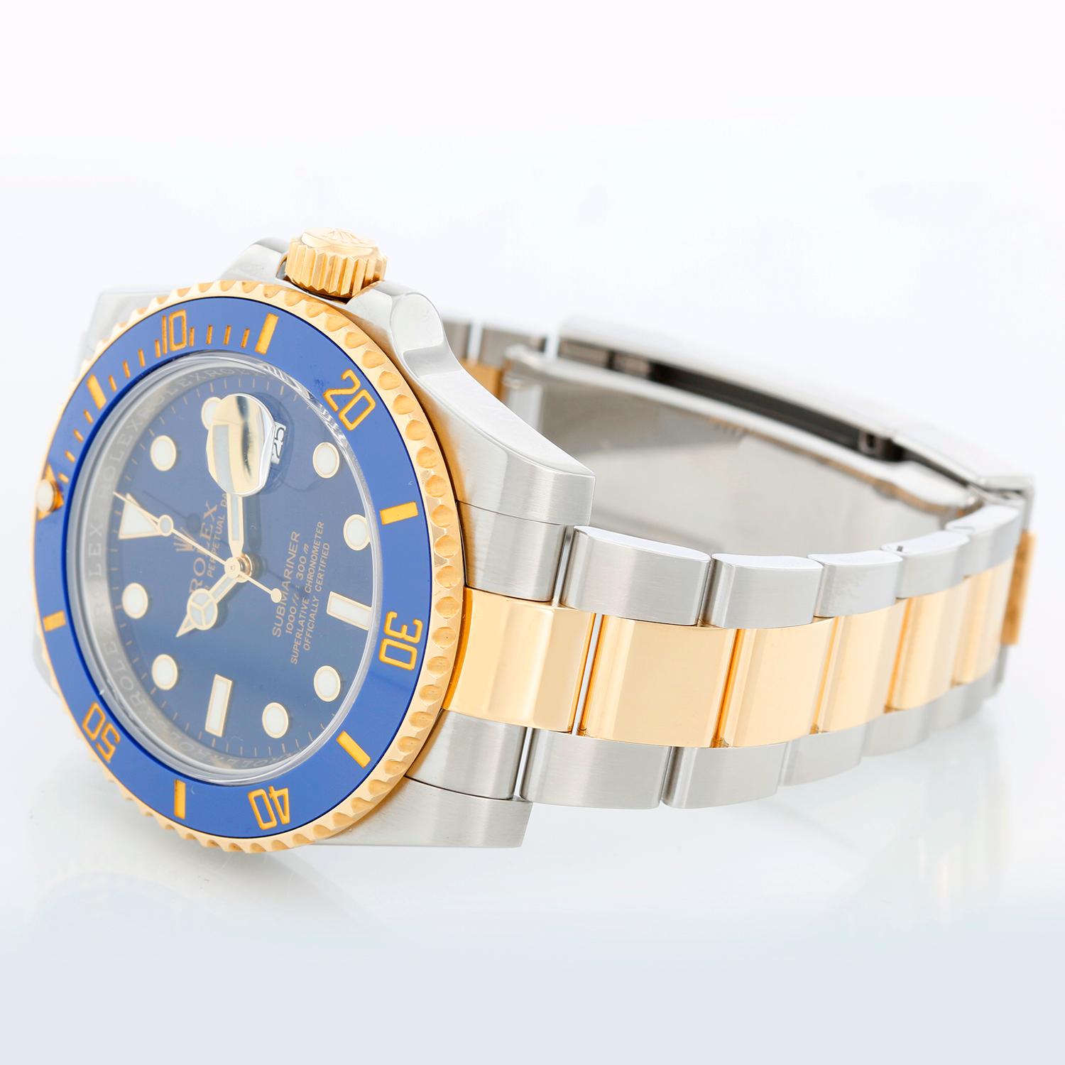 Rolex Submariner 2-Tone Steel & Gold Ceramic Engraved Bezel Watch 116613 - Automatic winding, 31 jewels. Stainless steel case with 18k yellow gold bezel with blue insert; engraved inner bezel  (40mm diameter). Blue dial with white markers; date at 3