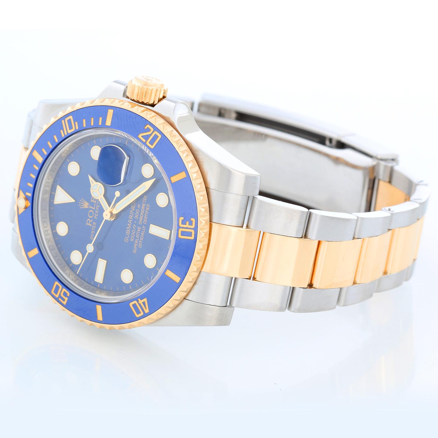 Rolex Submariner 2-Tone Steel & Gold Men's Watch 116613 - Automatic winding, 31 jewels, pressure proof to 1,000 feet. Stainless steel case with 18k yellow gold bezel  (40mm diameter). Blue  dial with luminous markers; date at 3 o'clock. Two tone