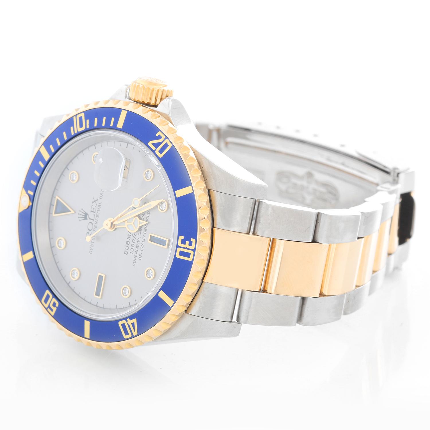 Rolex Submariner 2-Tone Steel & Gold Men's Watch 16613 - Automatic winding. Stainless steel case with gold rotating bezel with blue insert. Rolex Silver Serti Diamond and Sapphire Dial. Rolex oyster bracelet. Pre-owned with custom box.