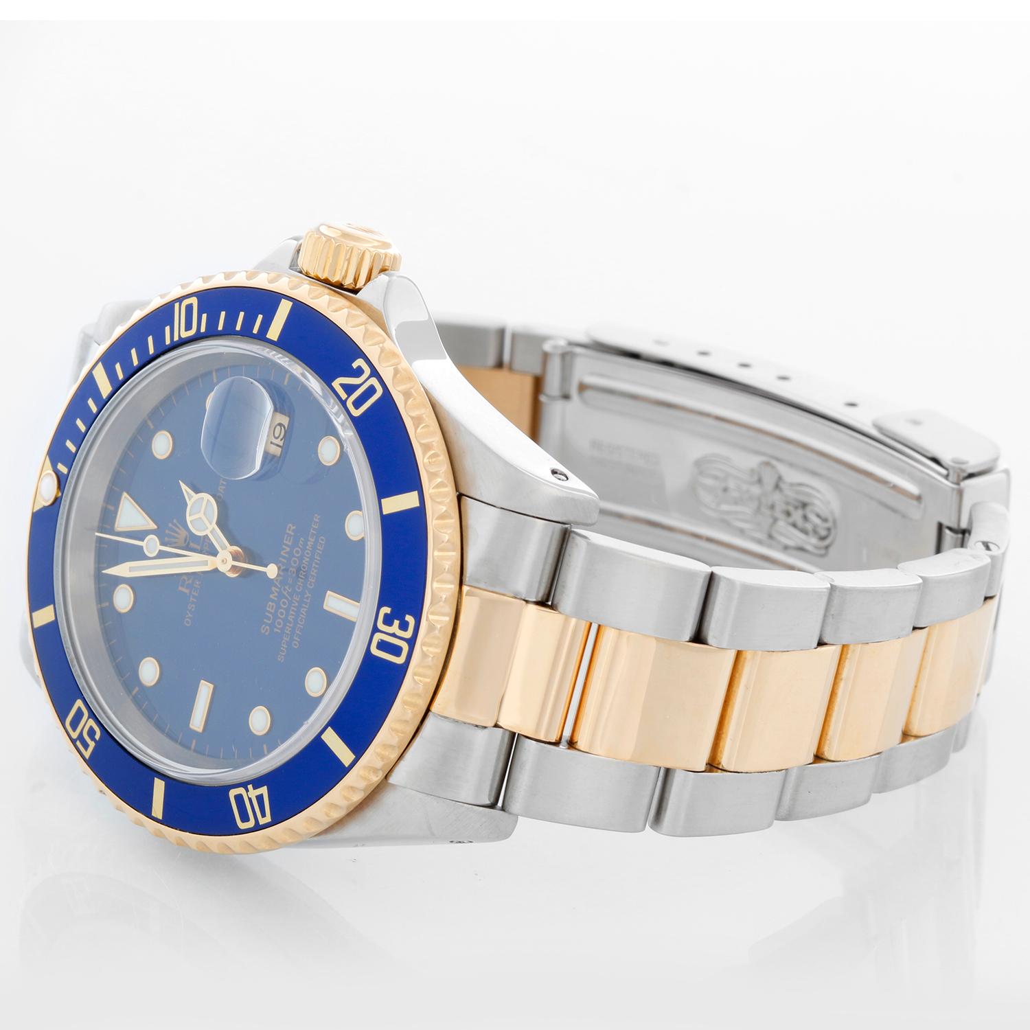 Rolex Submariner 2-Tone Steel & Gold Men's Watch 16613 - Automatic winding. Stainless steel case with gold rotating bezel with blue insert. Blue dial . Rolex oyster bracelet. Pre-owned with custom box.