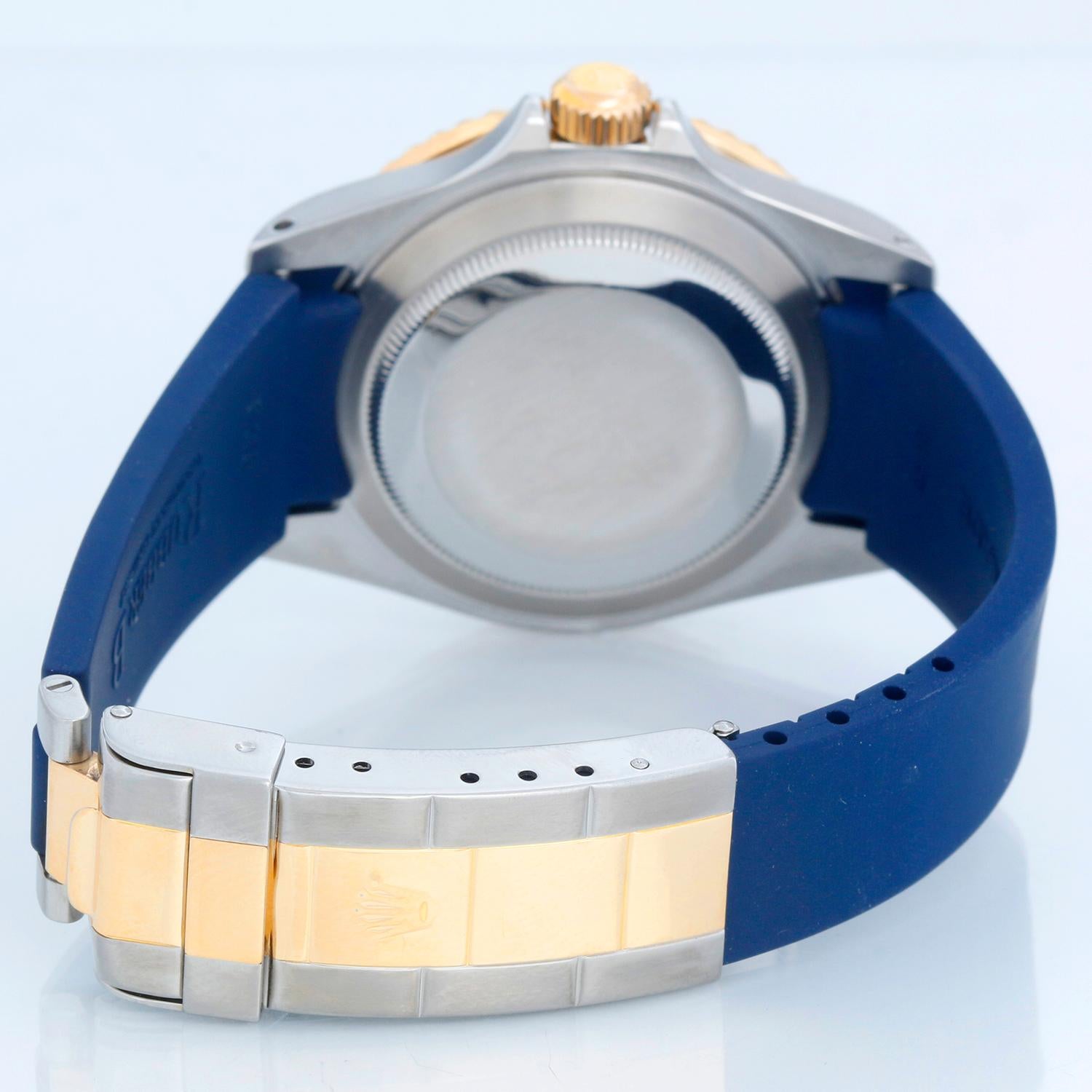 Rolex Submariner 2-Tone Steel & Gold Men's Watch 16613 - Automatic winding, 31 jewels, pressure proof to 1,000 feet. Stainless steel case with 18k yellow gold bezel with blue insert (40mm diameter). Blue dial with luminous markers; date at 3