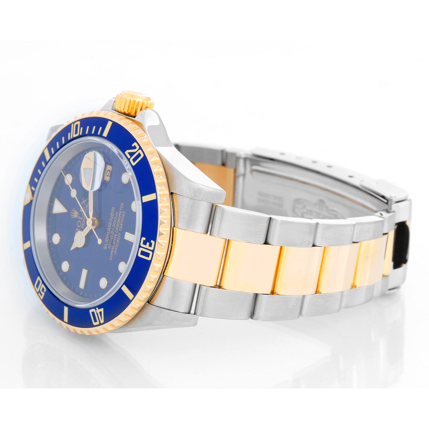 Rolex Submariner 2-Tone Steel & Gold Men's Watch 16613 - Automatic winding, 31 jewels, pressure proof to 1,000 feet. Stainless steel case with 18k yellow gold bezel . Blue dial with luminous markers; date at 3 o'clock. Stainless steel and 18k yellow