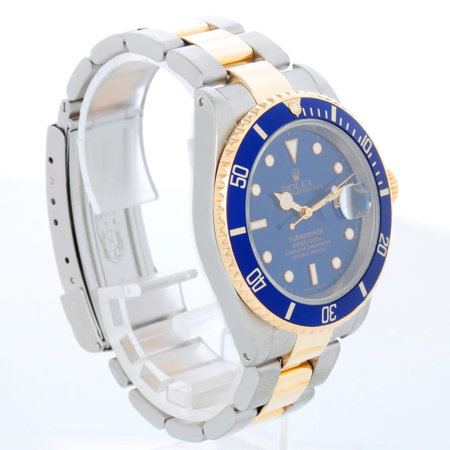 Rolex Submariner 2-Tone Steel & Gold Men's Watch 16613 - Automatic winding, 31 jewels, pressure proof to 1,000 feet. Stainless steel case with 18k yellow gold bezel  blue insert. Blue dial with luminous markers; date at 3 o'clock. Stainless steel