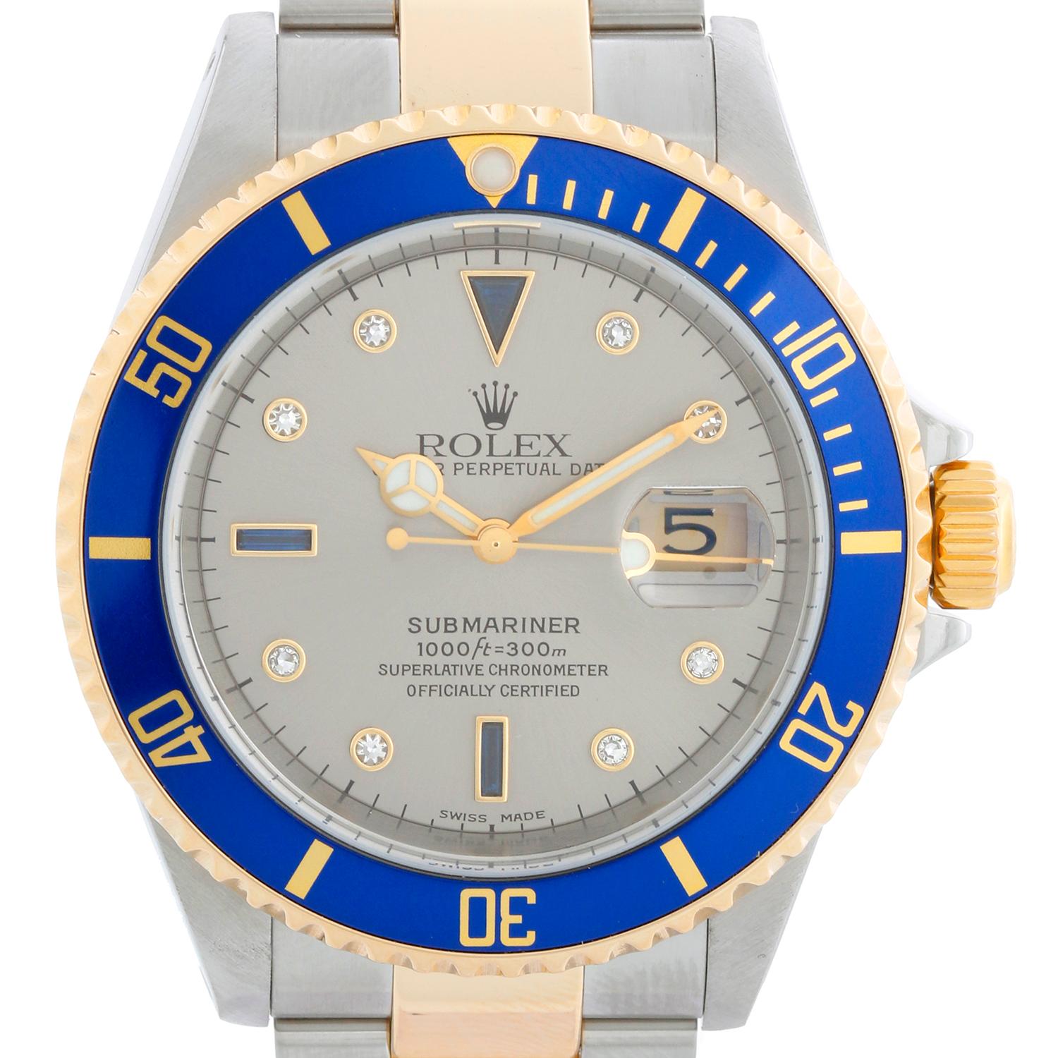 Rolex Submariner 2-Tone Steel & Gold Men's Watch 16613 - Automatic winding, 31 jewels. Stainless steel case with 18k yellow gold bezel with black insert (40mm diameter). Silver Serti dial with diamond hour markers and sapphire markers ; date at 3