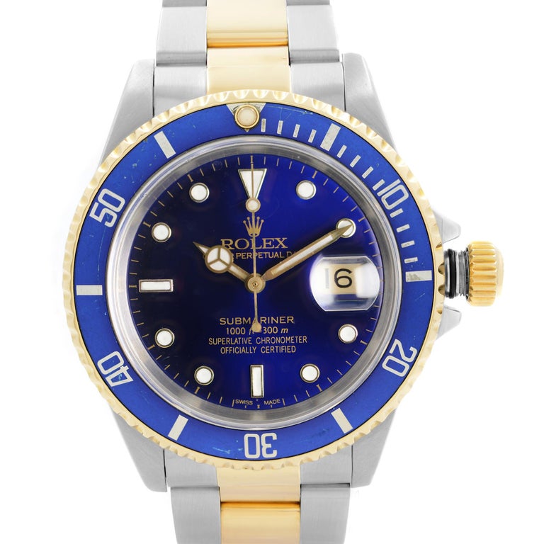Pre Owned Rolex Submariner 40mm 18k Gold Stainless Steel Blue Dial Automatic men's Watch 16613. This Beautiful Timepiece Was Produced in 1991 & is Powered by Mechanical (Automatic) Movement And Features: Round Stainless Case with 18k Gold & Steel