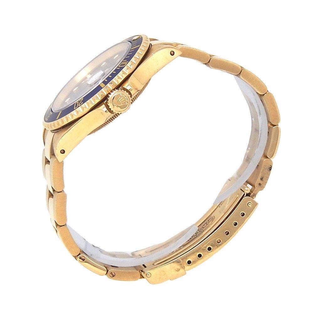 Brand: Rolex
Band Color: Yellow Gold	
Gender:	Men's
Case Size: 40-43.5mm	
MPN: Does Not Apply
Lug Width: 20mm	
Features:	Date Indicator, Gold Bezel, Luminous Dial, Luminous Hands, Non-Numeric Hour Marks, Rotating Bezel, Sapphire Crystal, Swiss Made,