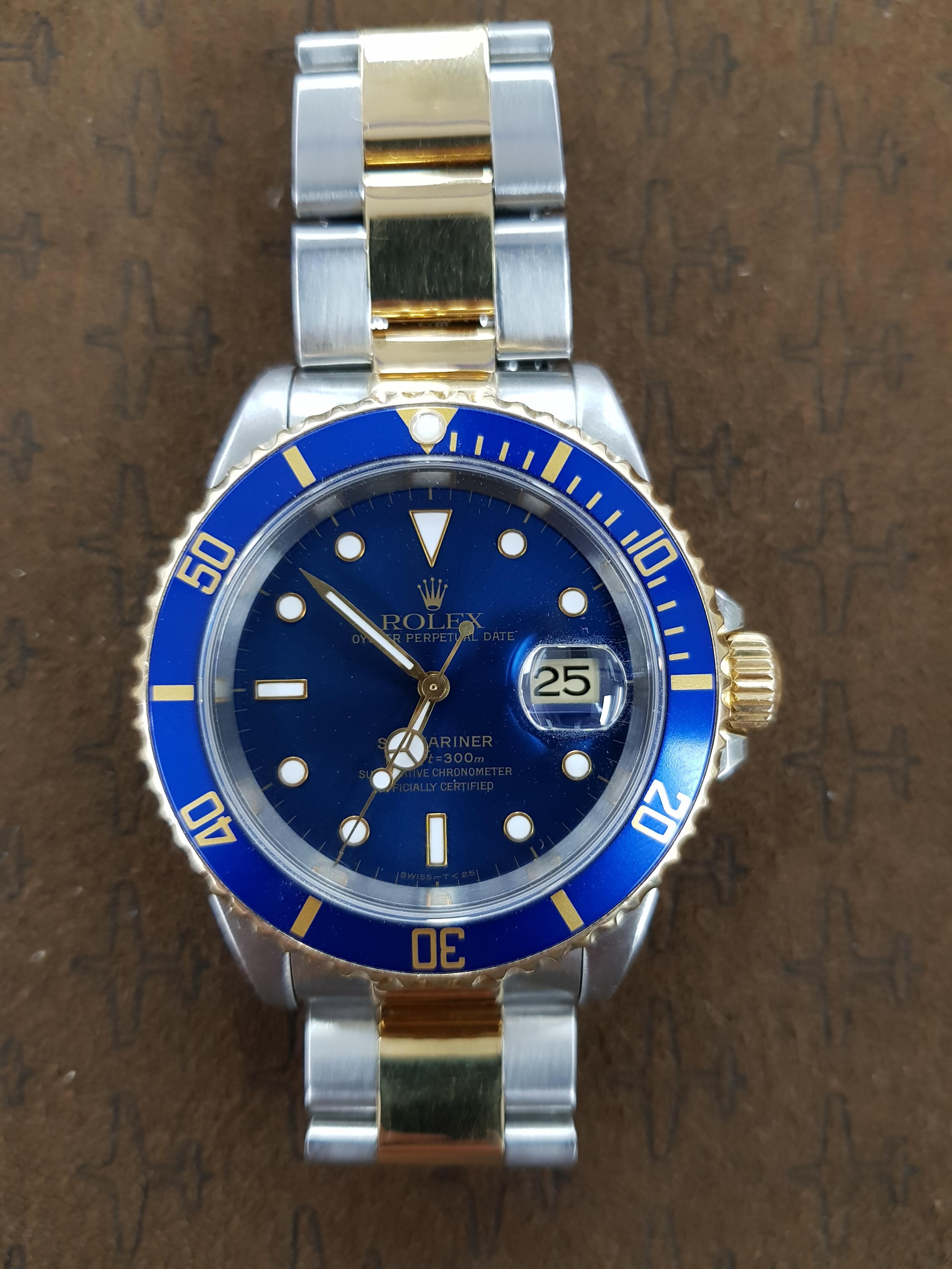 Bi-metal Rolex Submariner (pre ceramic) 40mm dial. Combines yellow gold with stainless steel. This watch comes with full Rolex certification.