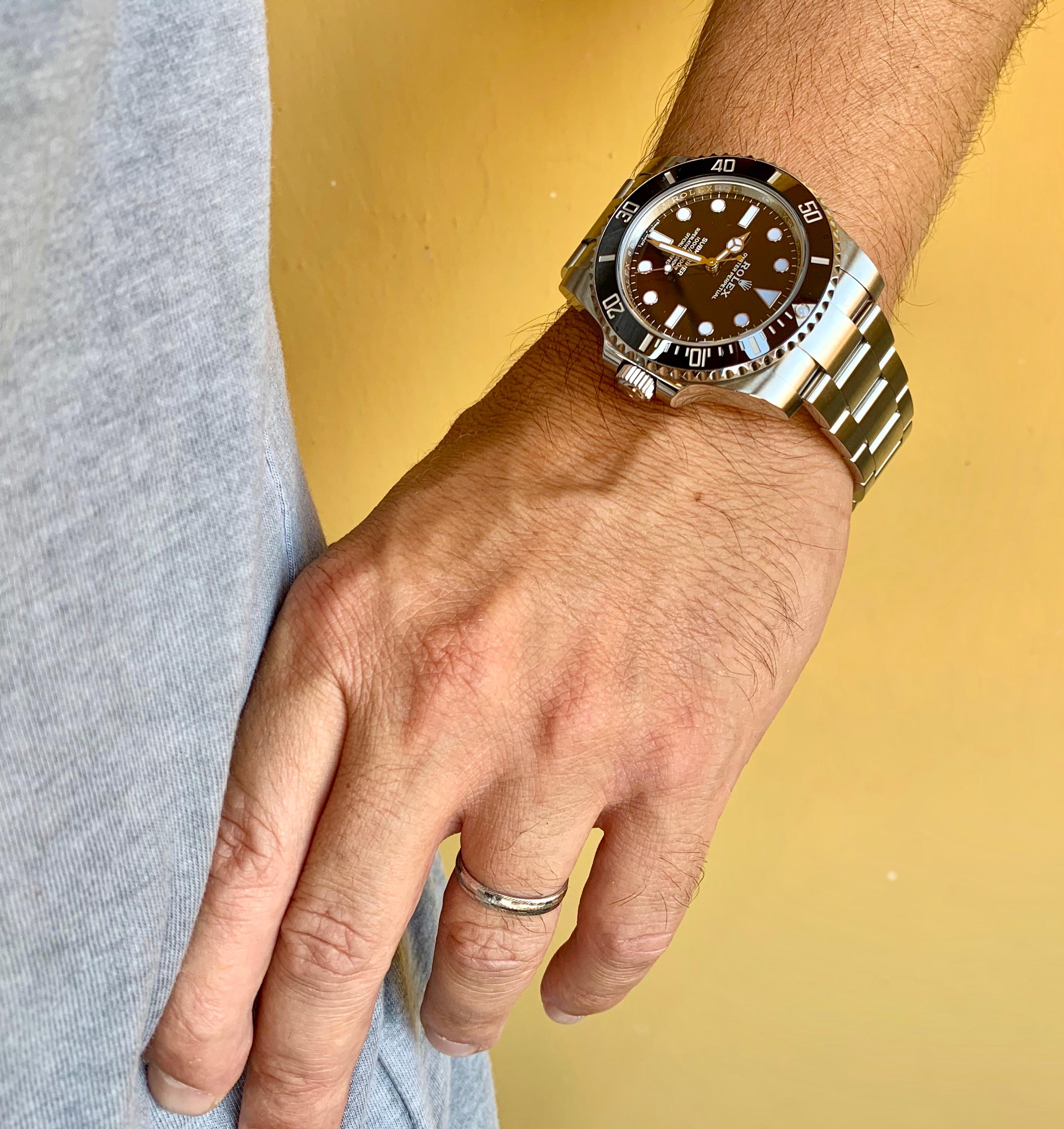 rolex submariner on wrist