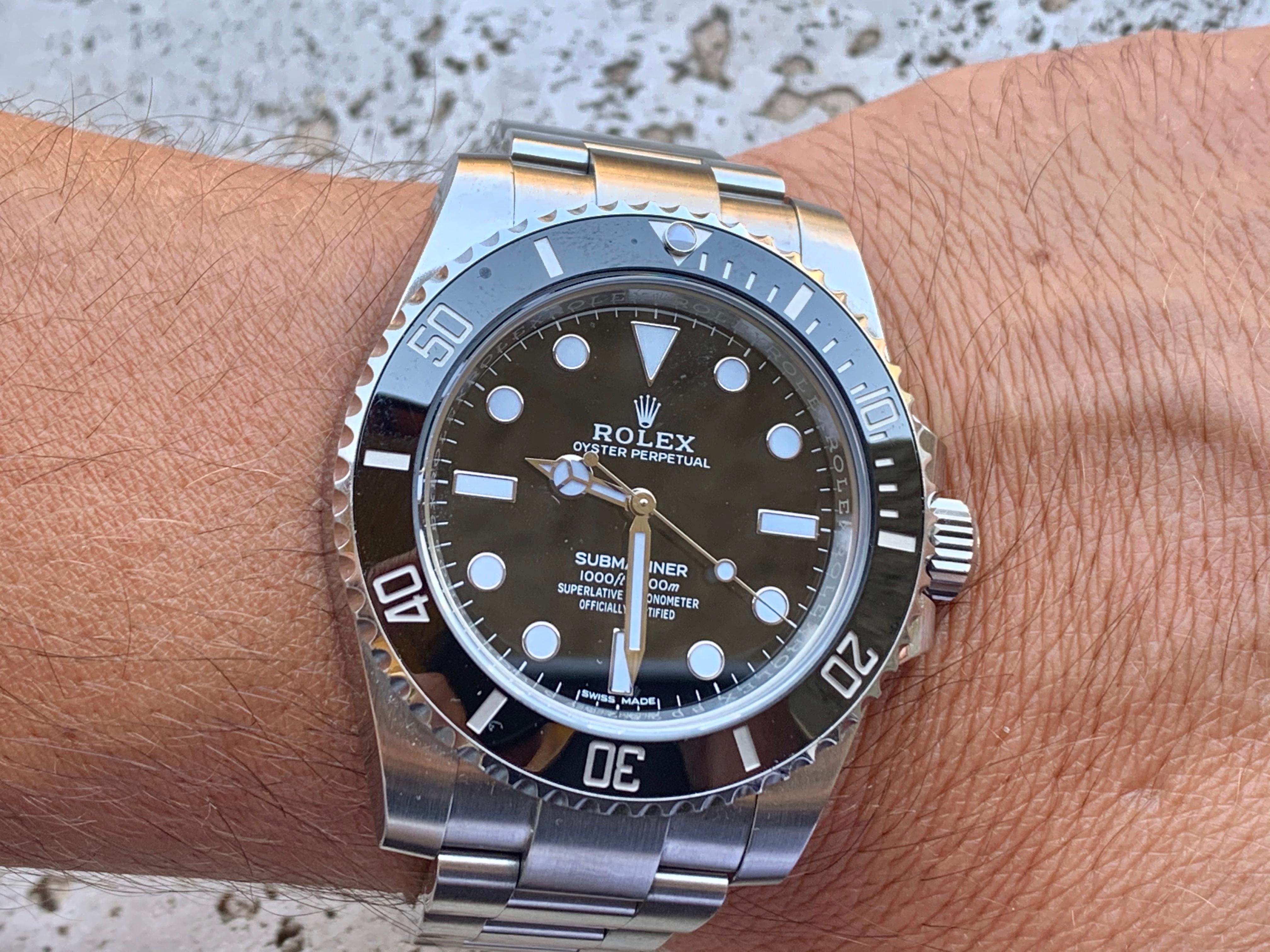 rolex submariner on wrist