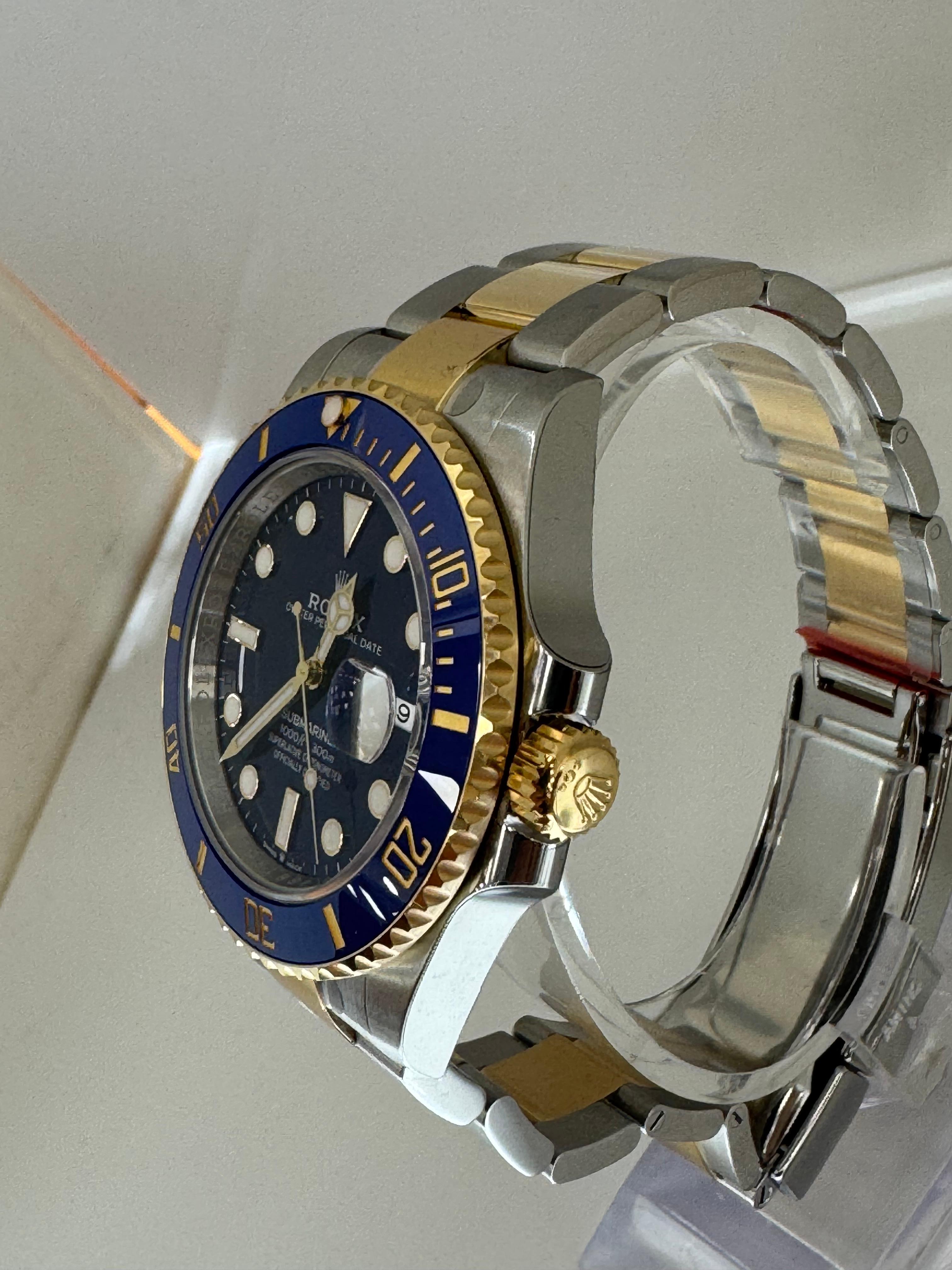 Product Description

Experience the perfect balance of luxury and performance with the Rolex Submariner Date 126613LB. This stunning timepiece features a 41mm stainless steel and 18k yellow gold case, paired with a vibrant sunburst blue dial and a