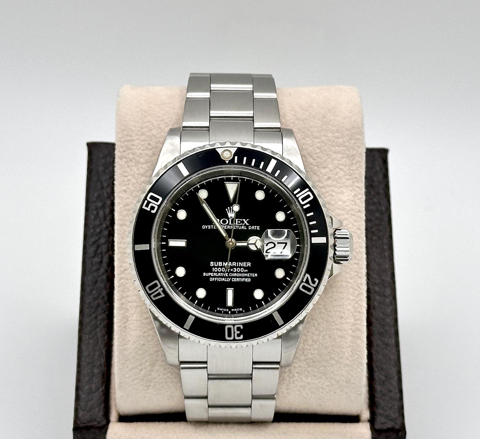 Style Number: 16610

Serial: K795***

Year: 2001

Model: Rolex Submariner Date

Case Material: Stainless Steel

Band: Stainless Steel

Bezel: Black

Dial: Black

Crystal: Sapphire Crystal

Case Size: 40mm

Includes: 
-Elegant Watch Box 
-Certified