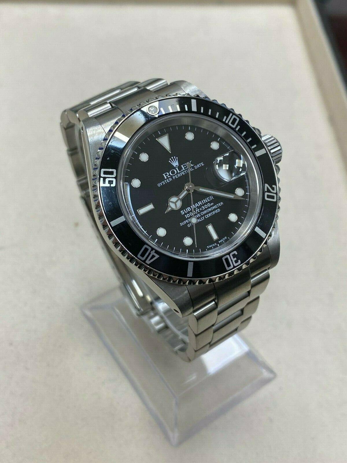 Style Number: 16110

 

Serial: K376***


Year: 2001

 

Model: Submariner

 

Case Material: Stainless Steel

 

Band: Stainless Steel

 

Bezel:  Black

 

Dial: Black

 

Face: Sapphire Crystal

 

Case Size: 40mm

 

Includes: 

-Elegant Watch