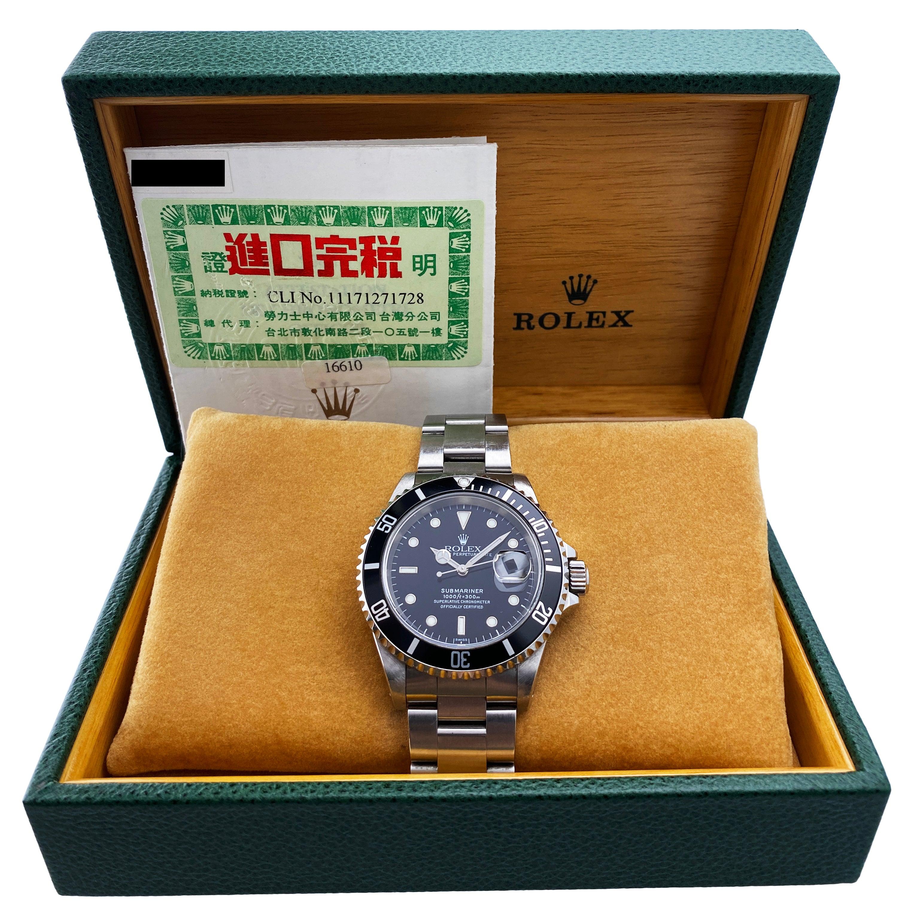 Rolex Oyster Perpetual Submariner Date 16610 Mens Watch. 40mm stainless steel case. Unidirectional rotating stainless steel bezel with black bezel insert. Black dial with steel luminous hands and dot hour markers. Magnified date display at 3 o'clock