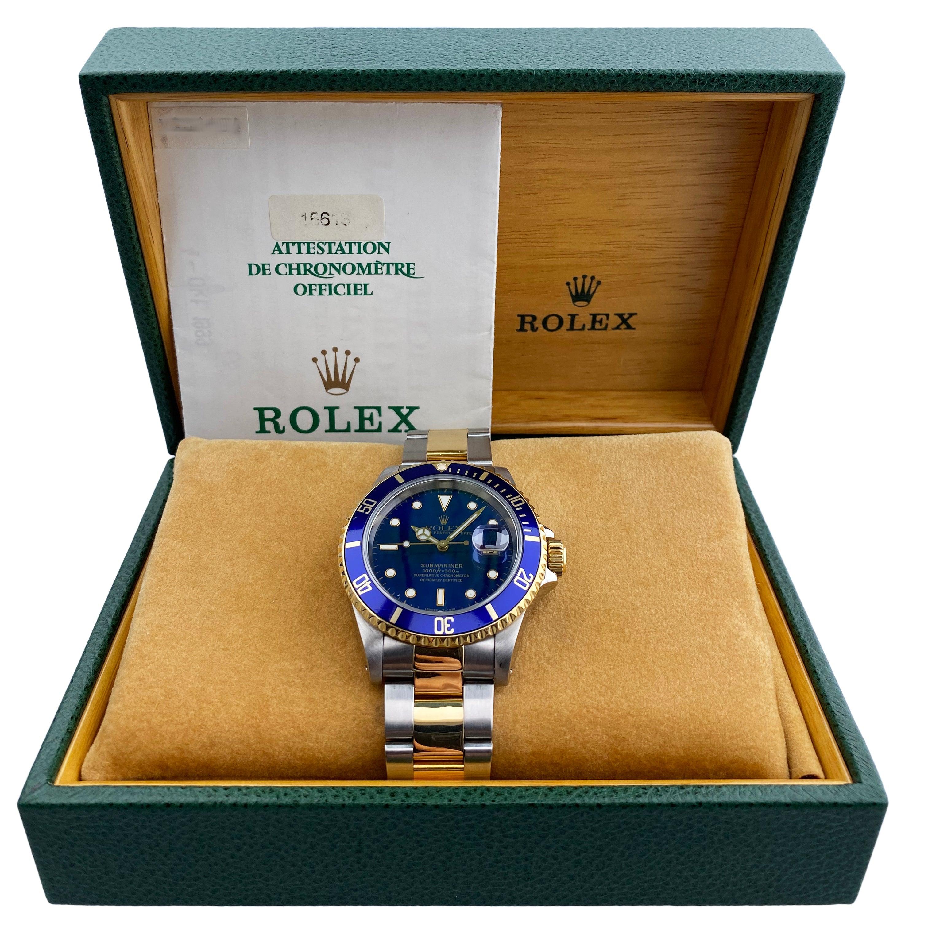 Rolex oyster perpetual Submariner Date 16613 Men's Watch. 40mm Stainless steel case with 18k yellow gold bezel with blue bezel insert. Blue dial with gold luminous hands and dot hour markers. Stainless steel & 18K yellow gold oyster bracelet with