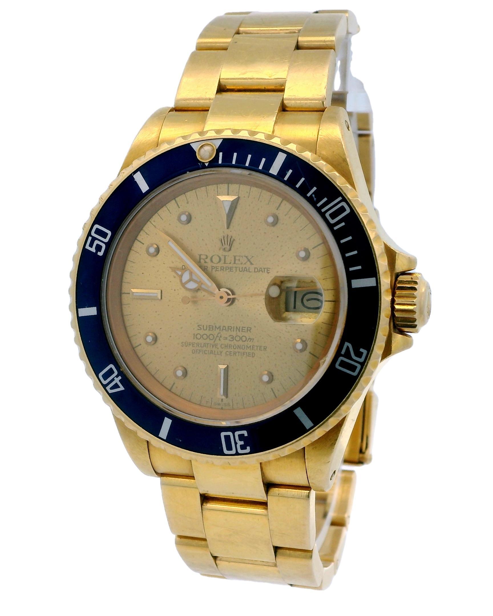 Rolex Oyster Perpetual Submariner Date 16808 Men's Watch. It features a 40mm case made of 18K yellow gold. The watch has a unidirectional rotating bezel, also in 18K yellow gold, with a blue insert. The dial is champagne-colorchanged, showcasing