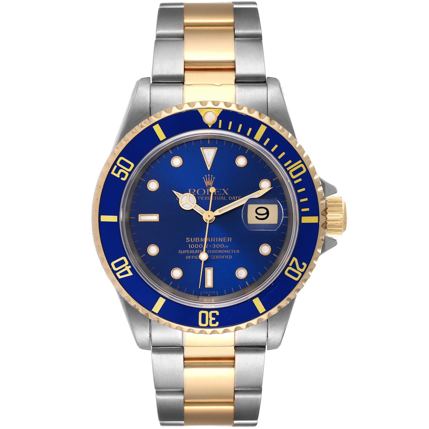 Rolex Submariner Date 40mm stainless steel and 18 karat yellow gold. The Z-serial 16613 includes a box. The Submariner features a blue dial with applied luminescent indices, a date aperture at three o’clock, and a unidirectional bezel. The case is