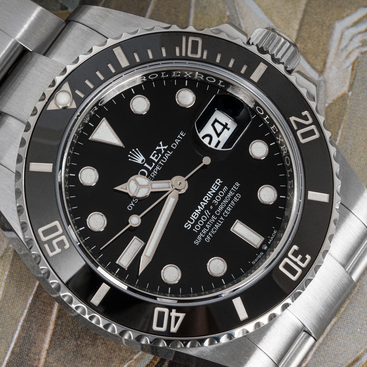 A 41mm Submariner Date in Oystersteel by Rolex. Features a black dial and a black ceramic unidirectional rotatable bezel with 60-minute graduations coated in platinum.

Fitted with a scratch-resistant sapphire crystal, a self-winding automatic