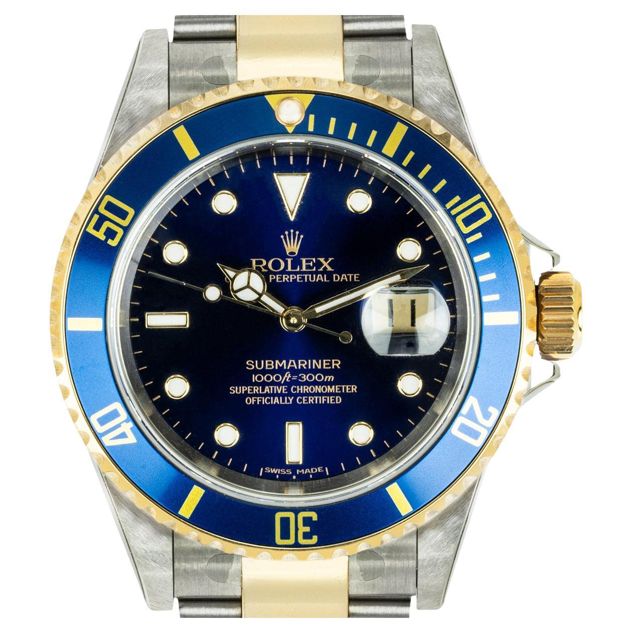 An Unworn Stainless Steel & 18k Yellow Gold Oyster Perpetual Submariner Date NOS Men's Wristwatch, blue dial with applied hour markers, date at 3 0'clock, an 18k yellow gold uni-directional rotating bezel with a blue bezel insert, a stainless steel