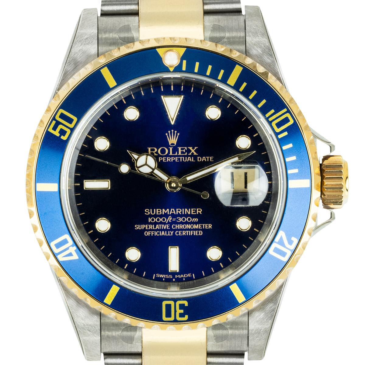 An Unworn Stainless Steel & 18k Yellow Gold Oyster Perpetual Submariner Date NOS Men's Wristwatch, blue dial with applied hour markers, date at 3 0'clock, an 18k yellow gold uni-directional rotating bezel with a blue bezel insert, a stainless steel