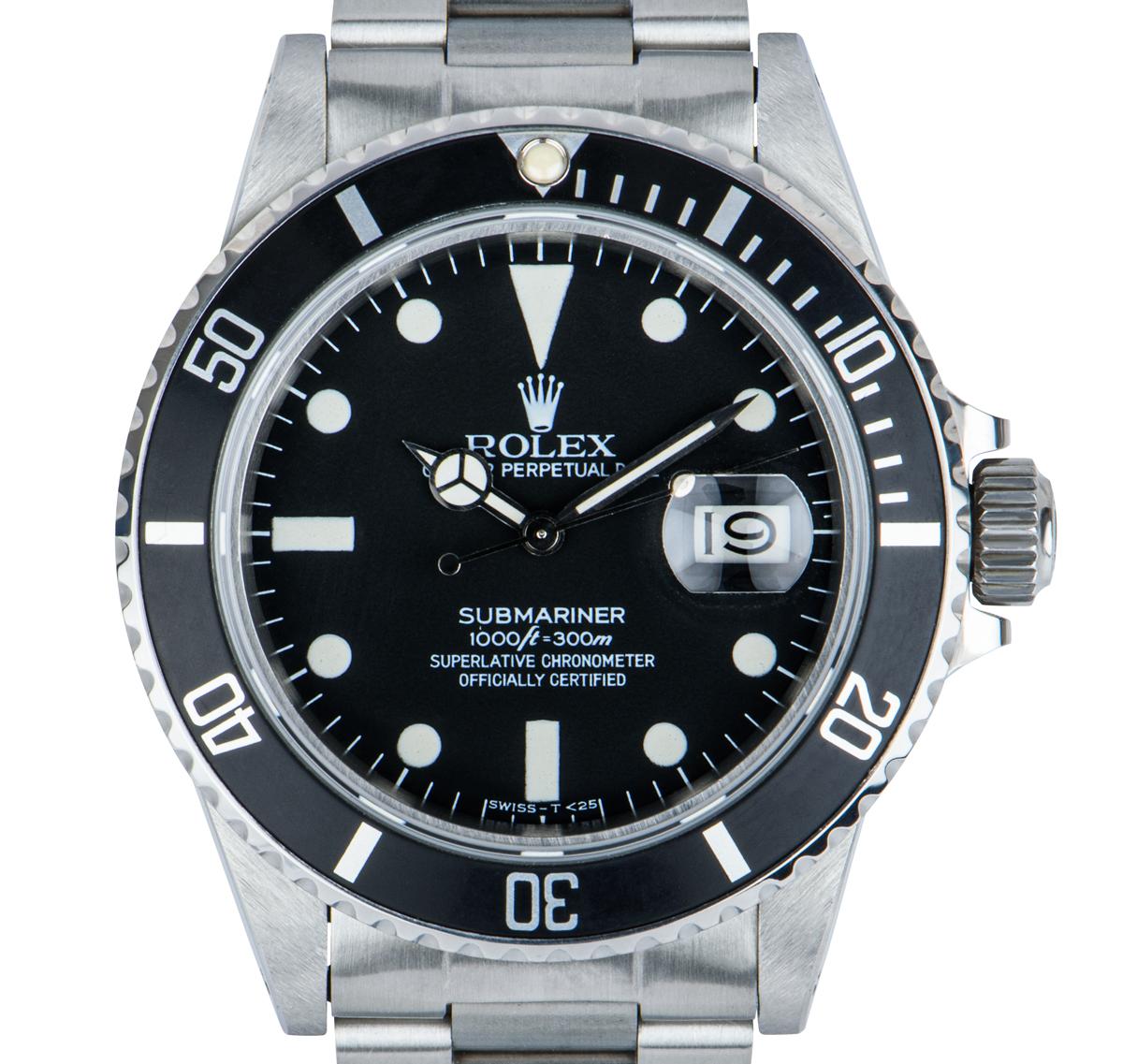 A 40mm vintage transitional Submariner Date crafted in stainless steel by Rolex. Features a matte black dial with a unidirectional rotating bezel and a black 60-minute graduation bezel insert. Fitted with a sapphire crystal, a self-winding automatic