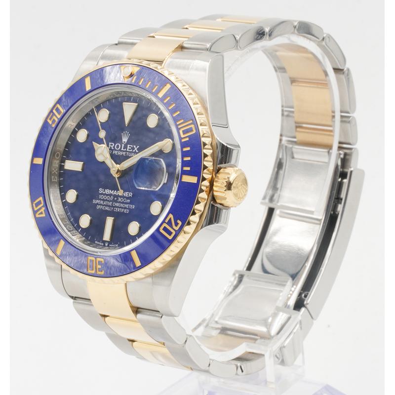 This Rolex Submariner was recently traded in to our store and is in very good condition. This watch will come with the full box and papers and the warranty is dated for 2021. This model is in a 41mm stainless steel case with two-tone yellow gold