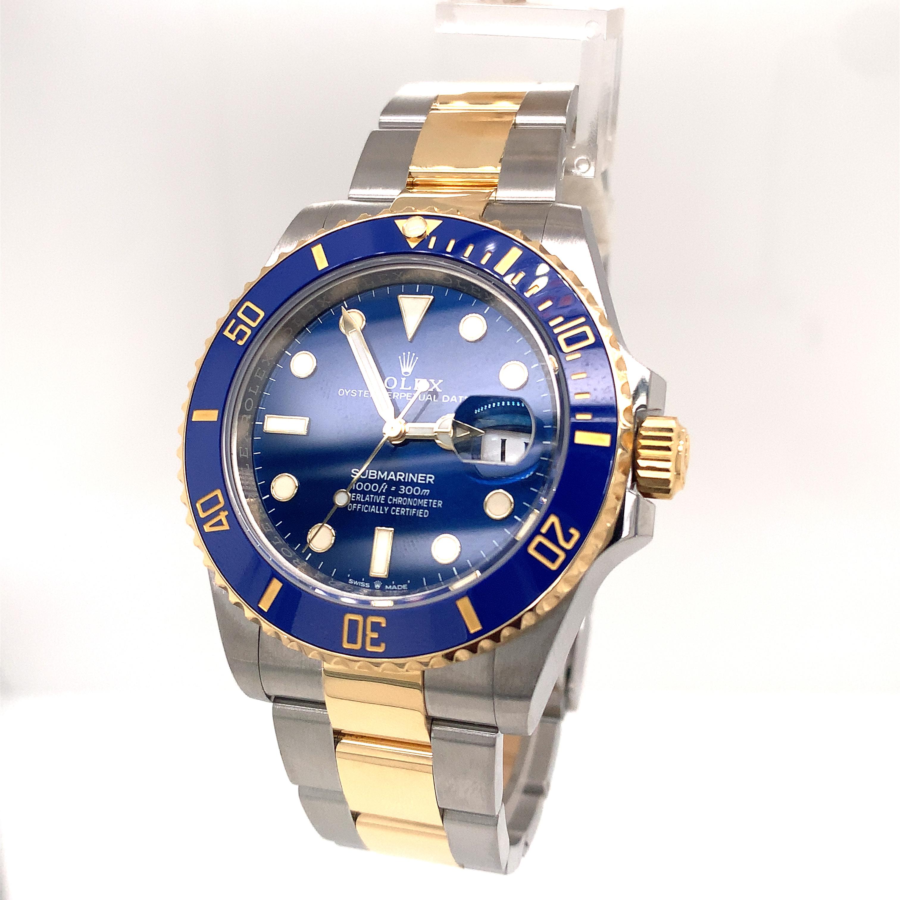 41mm stainless steel case, 18K yellow gold unidirectional rotatable bezel with blue Cerachrom disc, blue dial, and stainless steel and 18K yellow gold Oyster bracelet with Glidelock clasp. Water resistant to 300 meters (1000 feet). 
 Comes with