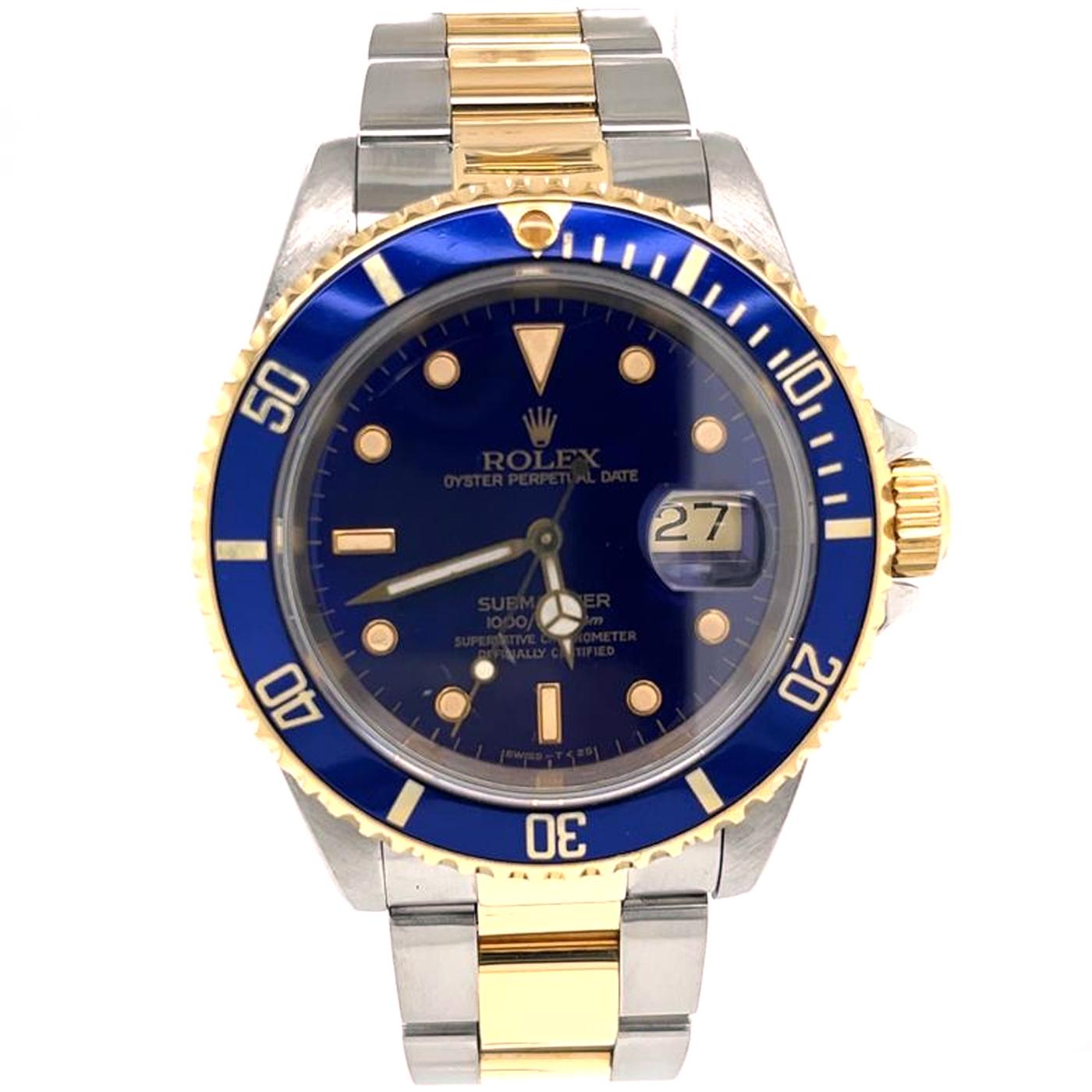 Rolex Submariner in stainless steel and 18k yellow gold, 16613. On the original stainless steel and 18k yellow gold Oyster bracelet with stainless steel and 18k yellow gold flip-lock de-ployant clasp. 18k yellow gold bezel with a blue aluminum bezel