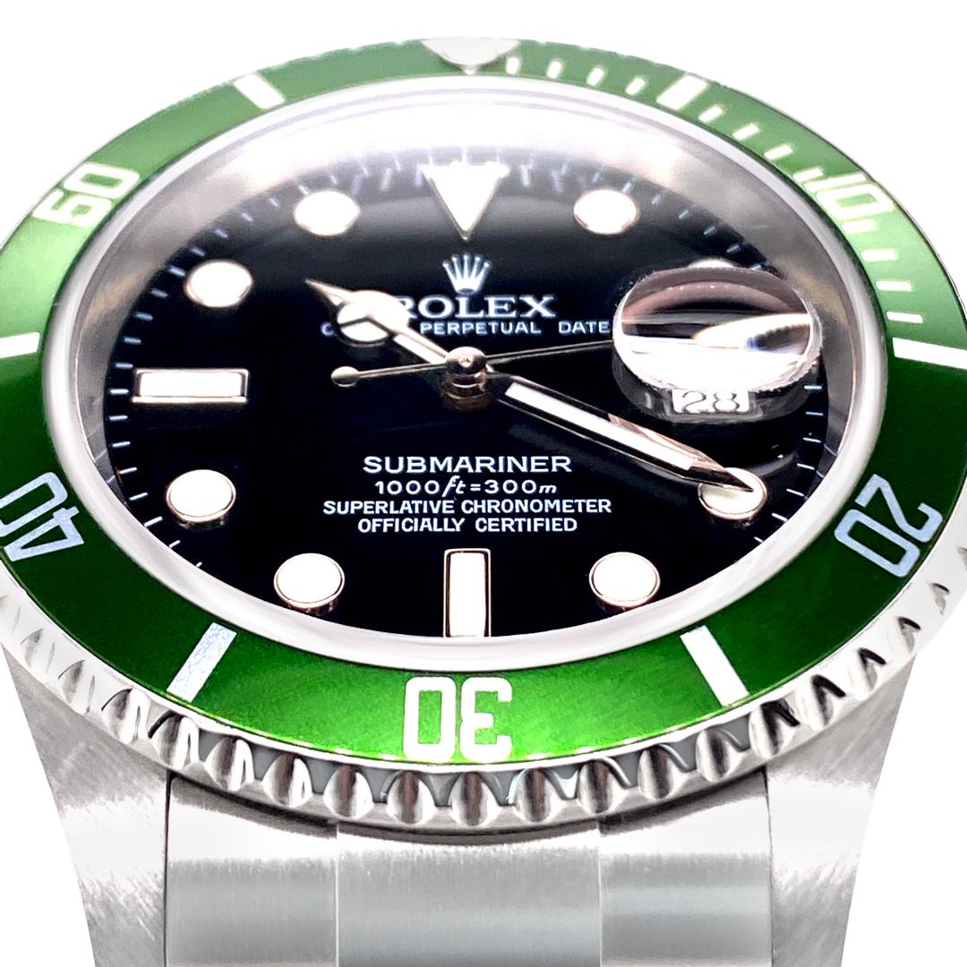 Beautiful condition Rolex Submariner Date with Green Anniversary Edition Bezel.  40mm Stainless Steel case.  Scratch resistant sapphire crystal.  Black dial with Superluminova hands and hour markers. Stainless Steel Oyster Bracelet with Oysterlock
