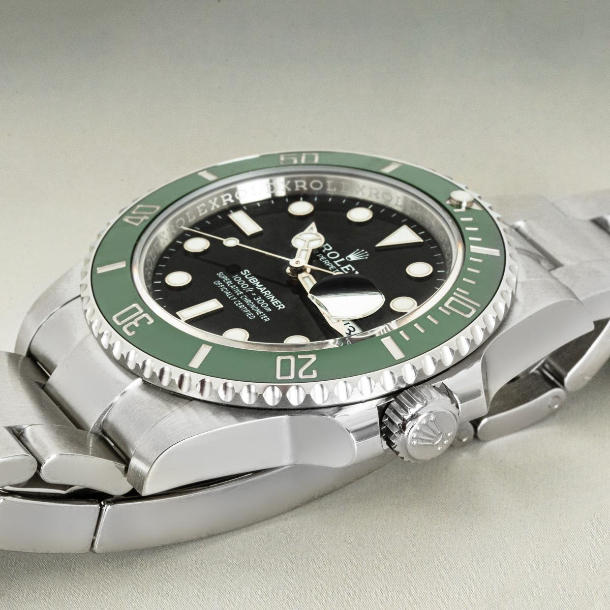 An unworn 41mm Submariner Date known as both a Kermit or Starbucks, from Rolex in Oystersteel. Features a black dial with the date display and a green ceramic unidirectional rotatable bezel; with this being a 2024 model, the shade of green used for