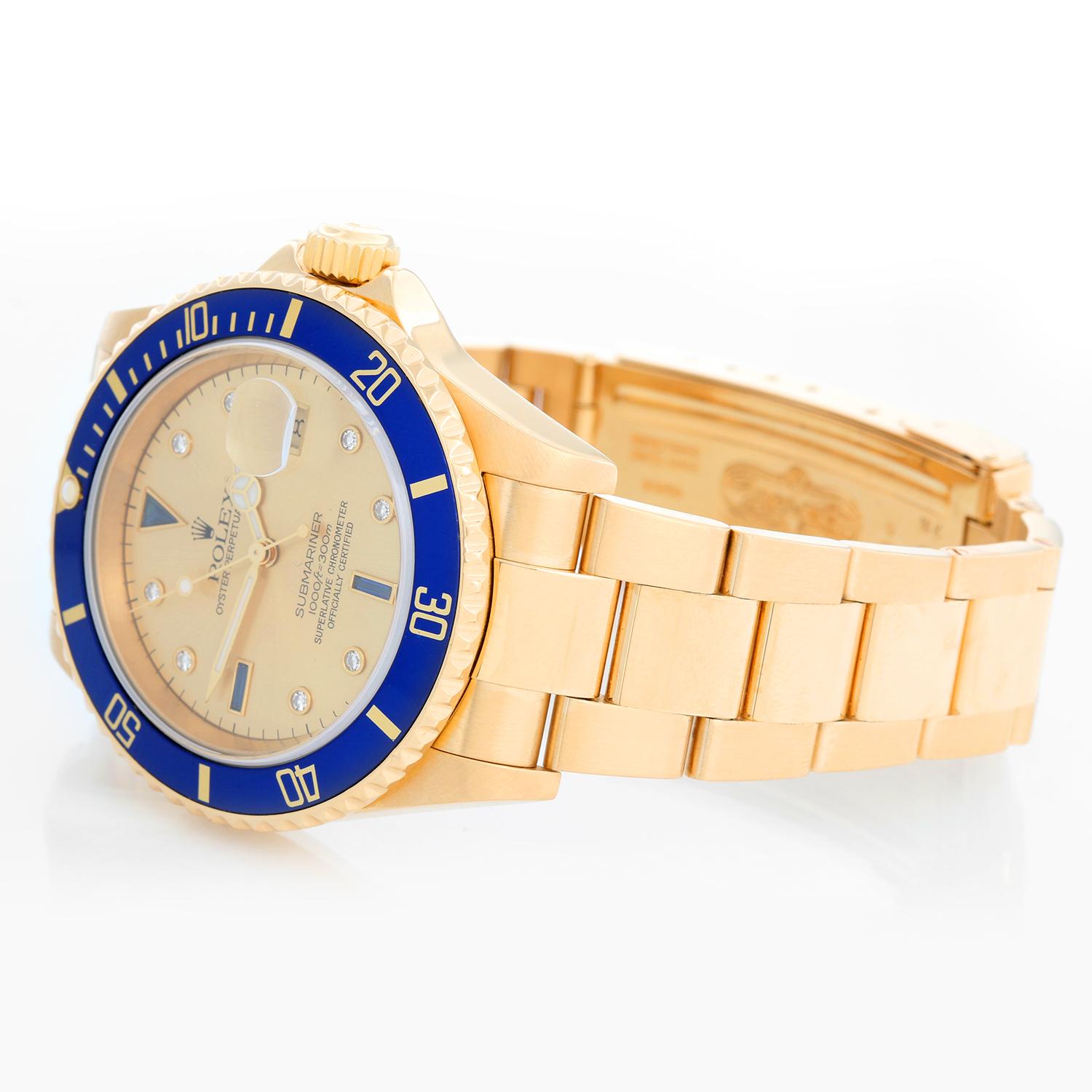 Rolex Submariner Men's 18k Gold Diver's Watch 16618 - Automatic winding, Quickset, sapphire crystal. 18k yellow gold case with rotating bezel with blue insert (40mm diameter).  Genuine Rolex Champagne Serti dial. 18k yellow gold Oyster bracelet with